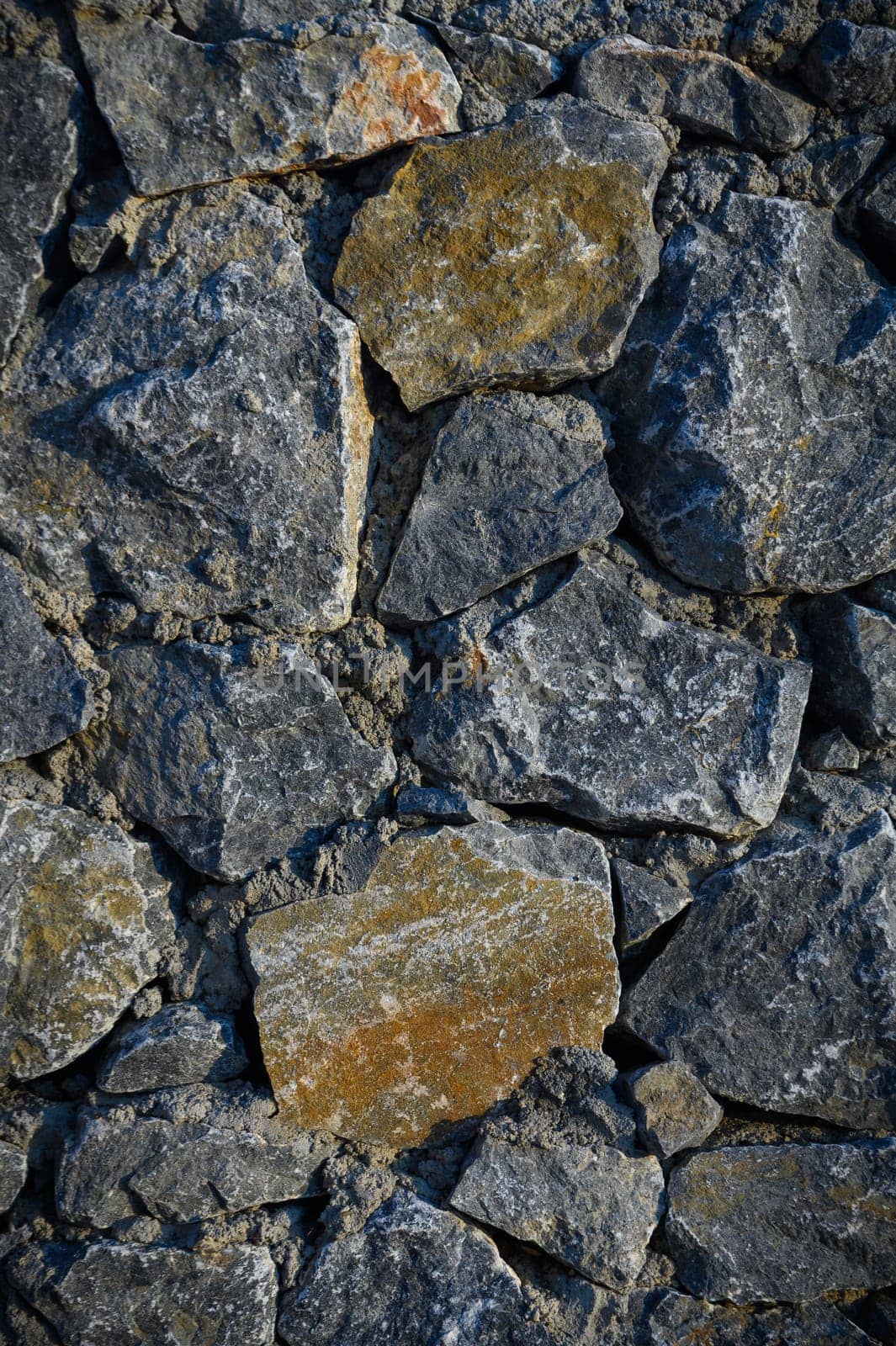 Wall with various size and shaped stones 3