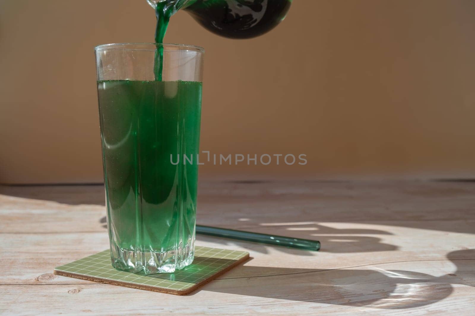 Organic blue-green algae spirulina detox drink in glass powder food. Health protein cocktail smoothie of chlorella. Vitamins and minerals to diet. Prebiotic and antioxidant rich Dietary supplement Seaweed superfood by anna_stasiia