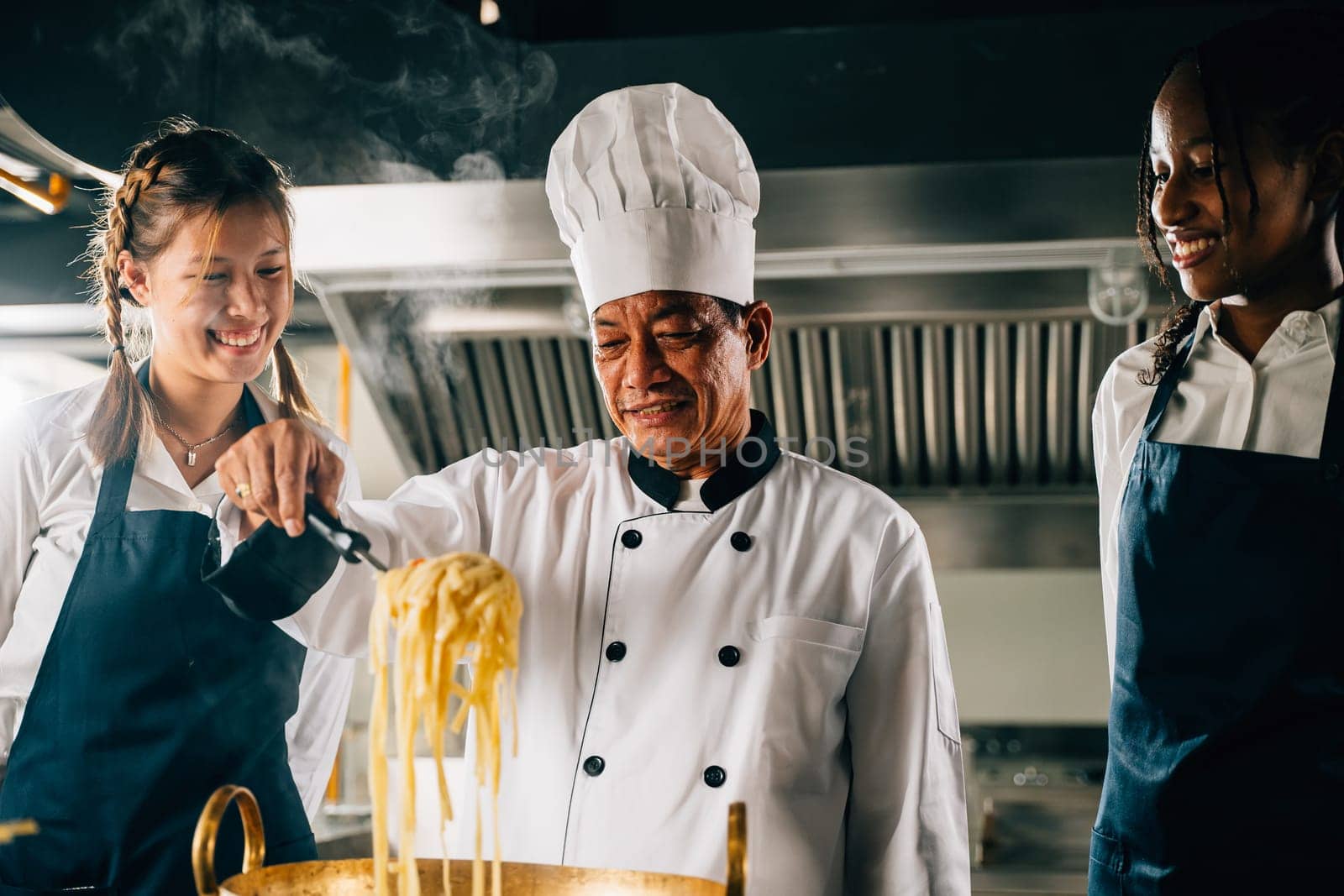 In kitchen chef teaches students. Schoolgirls in uniform make ramen. Kids at stove with teacher. Smiling portrait of learning is modern education. Making dinner with ladle gives joy.