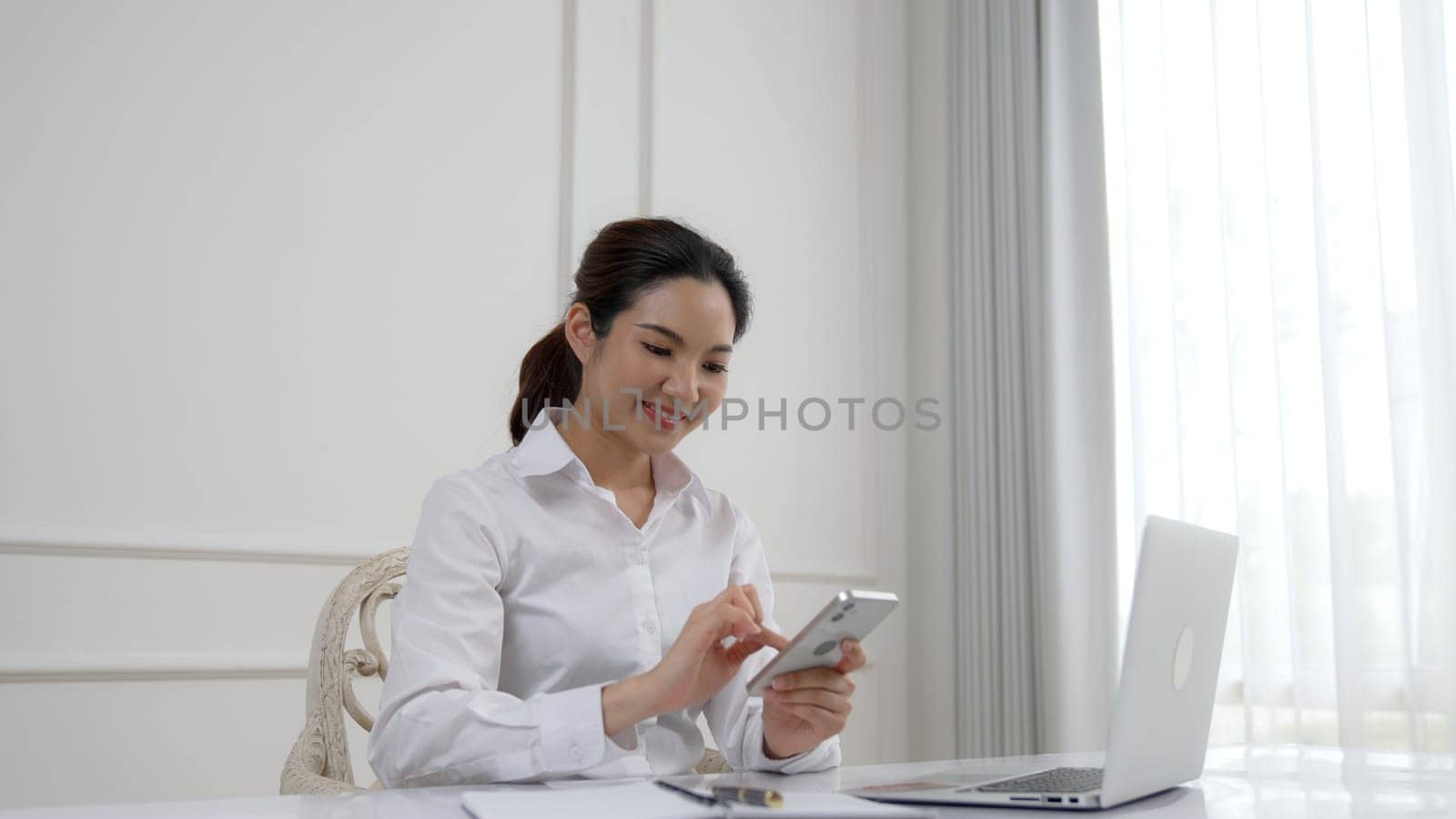 Young woman using vivancy smartphone with for online shopping E commerce. by biancoblue
