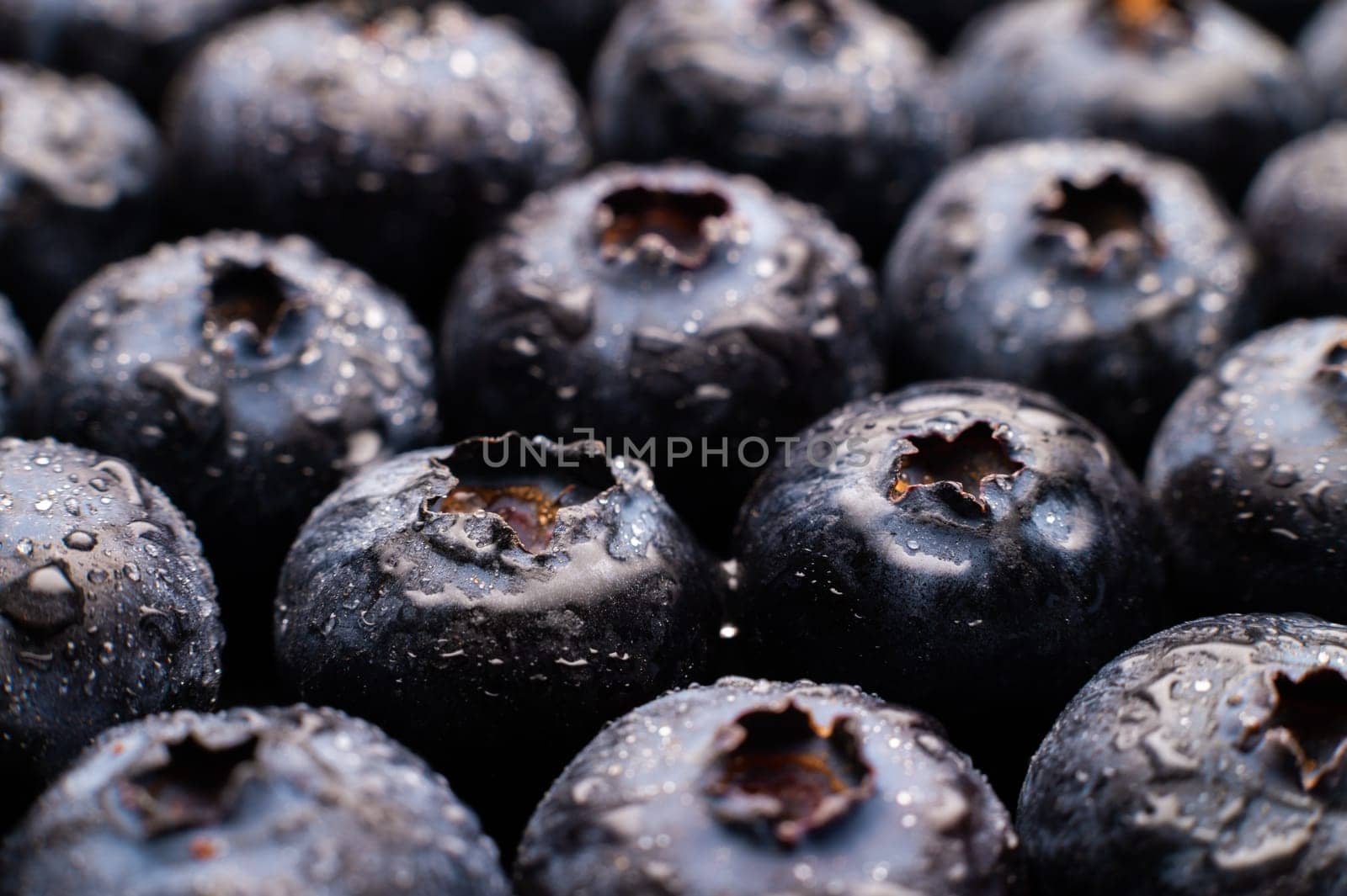 Ripe sweet blueberries. Fresh blueberries background. Vegan and vegetarian concept. Macrotexture of blueberries. Texture of blueberries close-up by yanik88