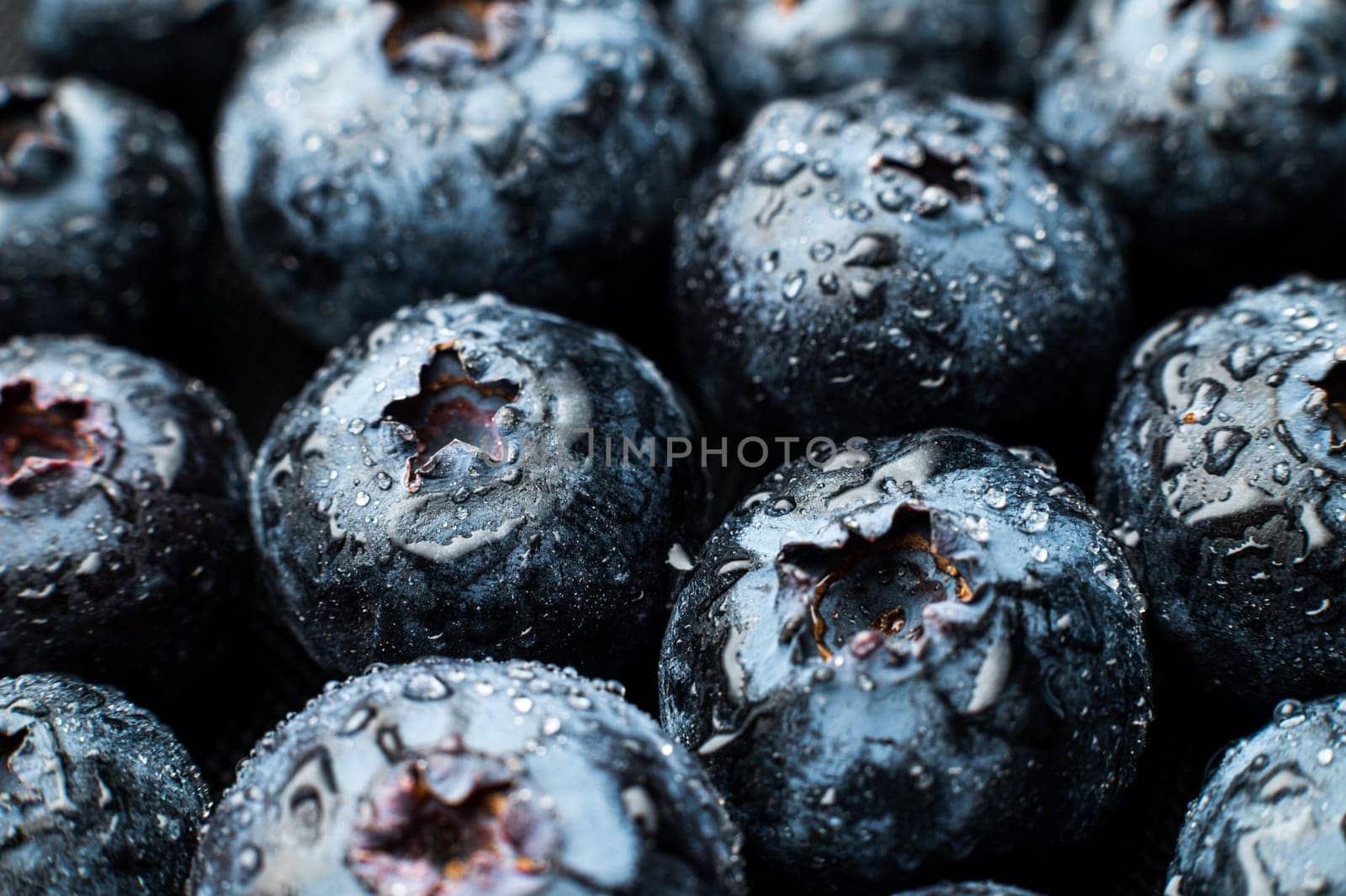 Ripe sweet blueberries. Fresh blueberries background. Vegan and vegetarian concept. Macrotexture of blueberries. Texture of blueberries close-up.