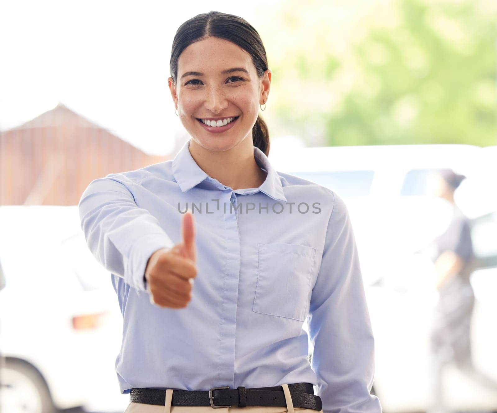 Business woman, thumbs up and portrait with feedback, review and thank you for agreement, success or support. Professional excellence, pride and praise with emoji, yes or like with vote in workplace by YuriArcurs