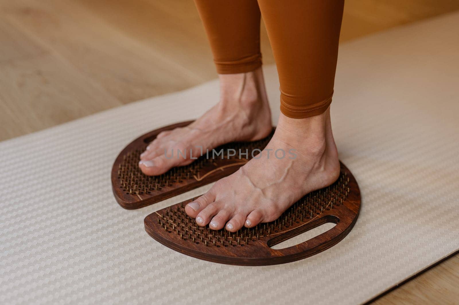 Acupressure in action with feet firmly placed on wooden sadhu boards by apavlin
