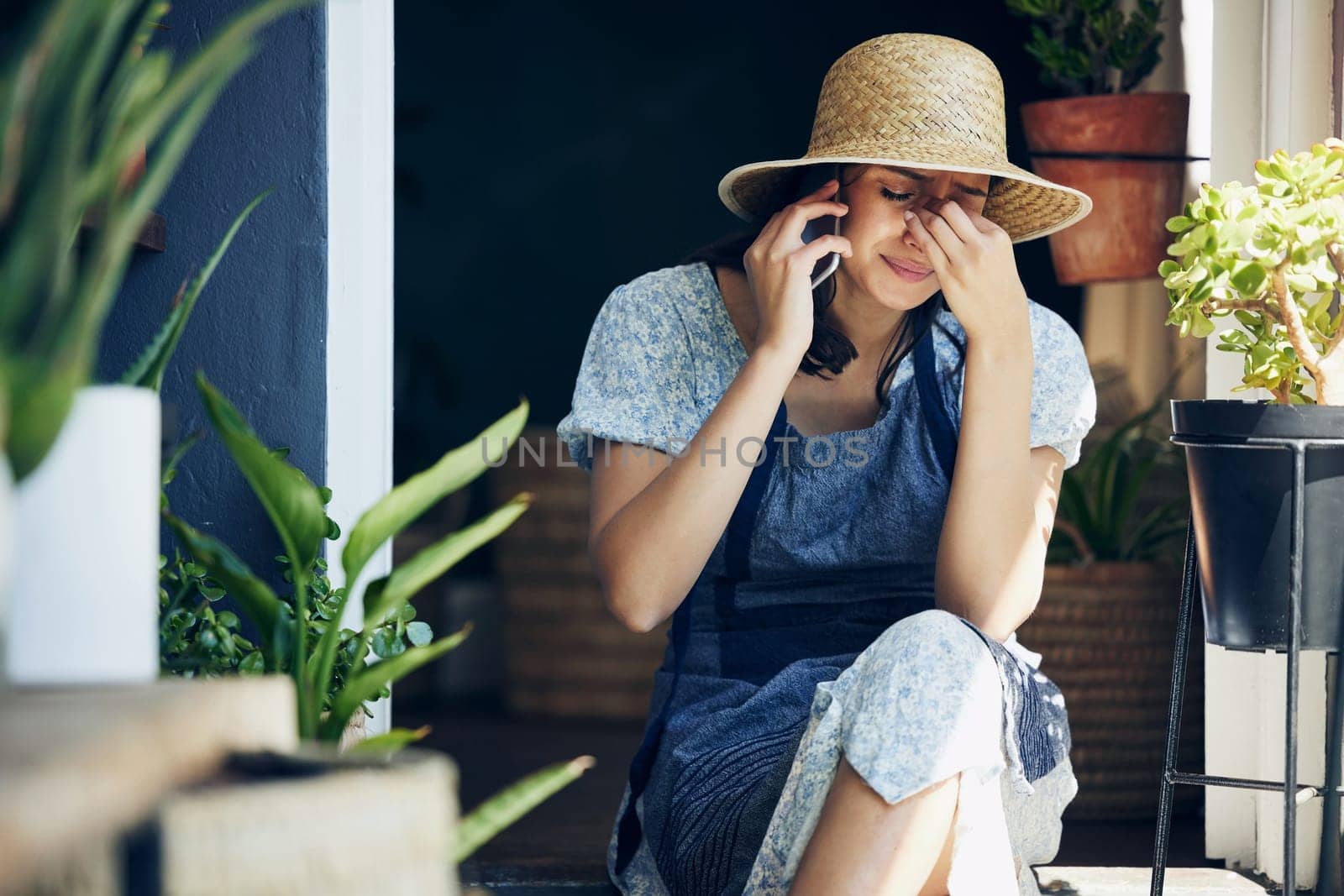 Woman, phone call and garden with crying from sad news, conversation and discussion at home. Housewife, outdoor and tears with emotional, stress and sorrow from heartbreak or upset and disappointed by YuriArcurs