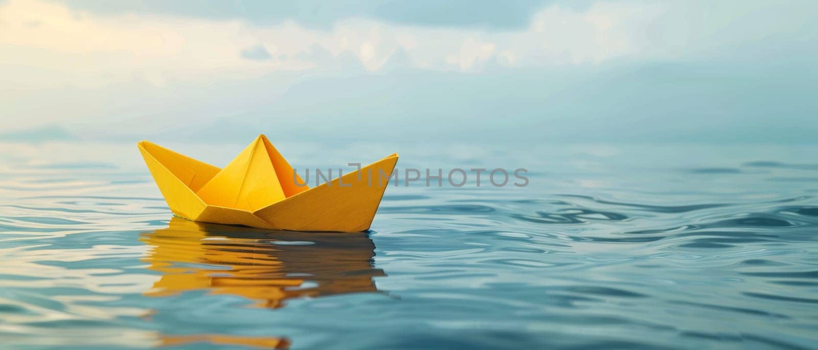 A vibrant yellow origami boat floats peacefully on a calm blue water surface, reflecting its bright color