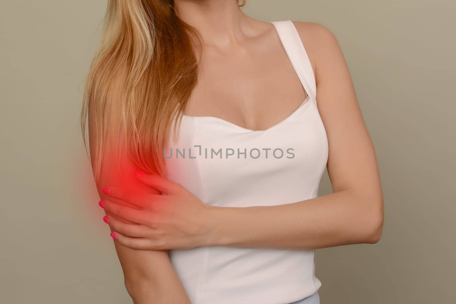 young woman experiencing pain in elbow joint by zartarn