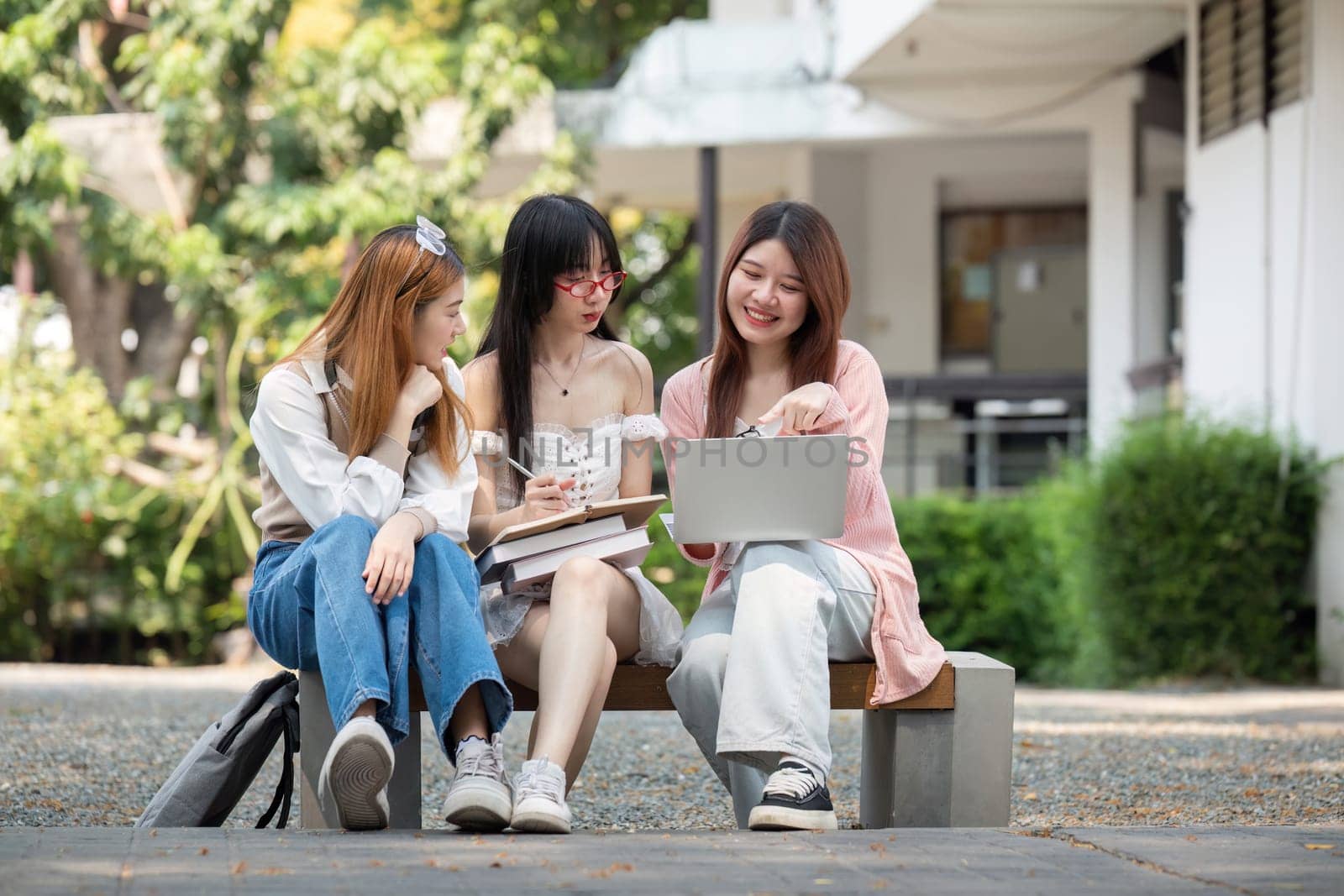 Asian young campus student enjoy learn study and reading books together. Friendship and Education concept. Campus school and university. Happiness and funny of learning in college.