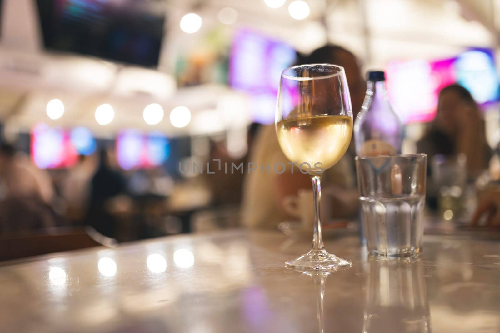 Glass of wine in restaurant, close up