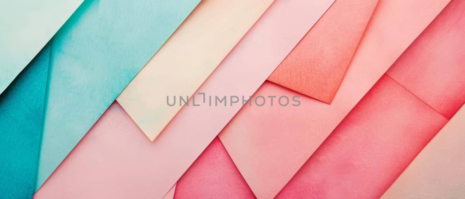 A top-down view of pastel paper layers in geometric shapes creating a textured abstract pattern. by sfinks