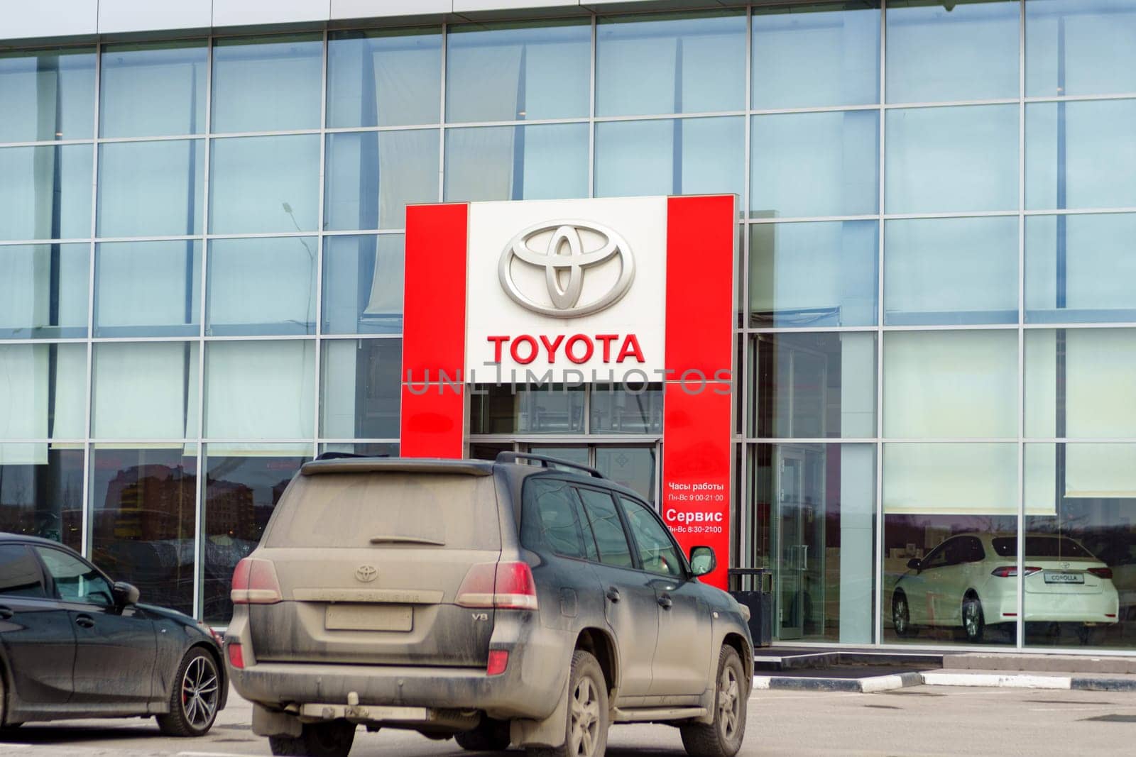 Tyumen, Russia-March 02, 2024: Toyota logo Sign Against Blue Sky. Selective focus