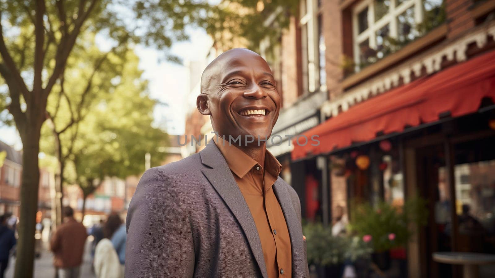 Portrait of cheerful happy smiling mature black businessman standing in the city, wearing business suit, looking away
