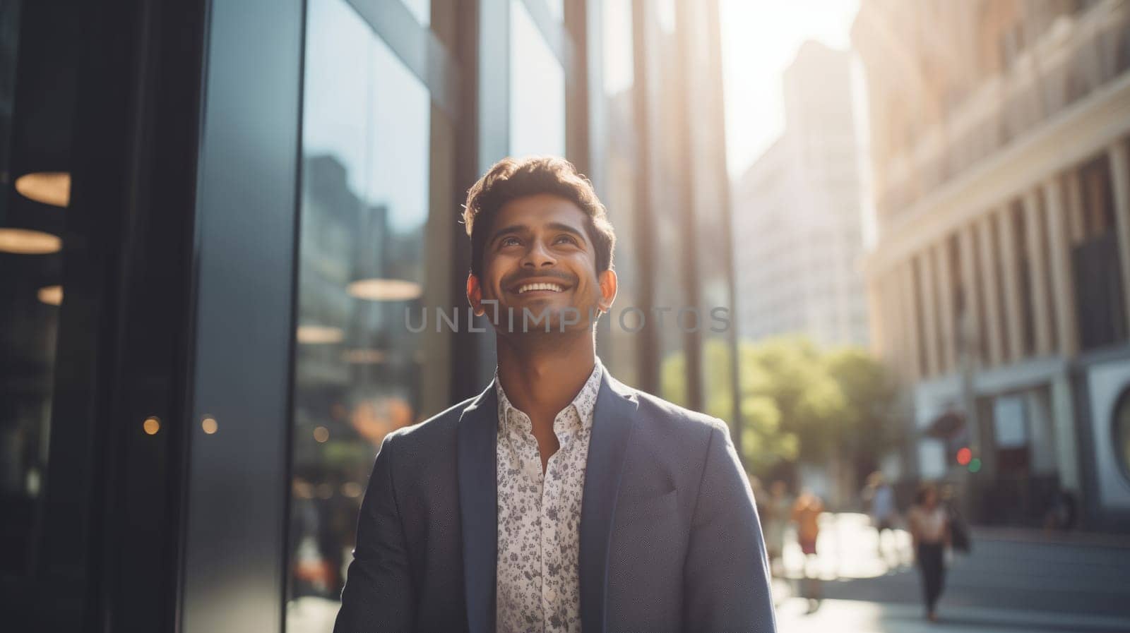 Confident happy smiling Indian entrepreneur standing in the city, wearing business suit and looking away