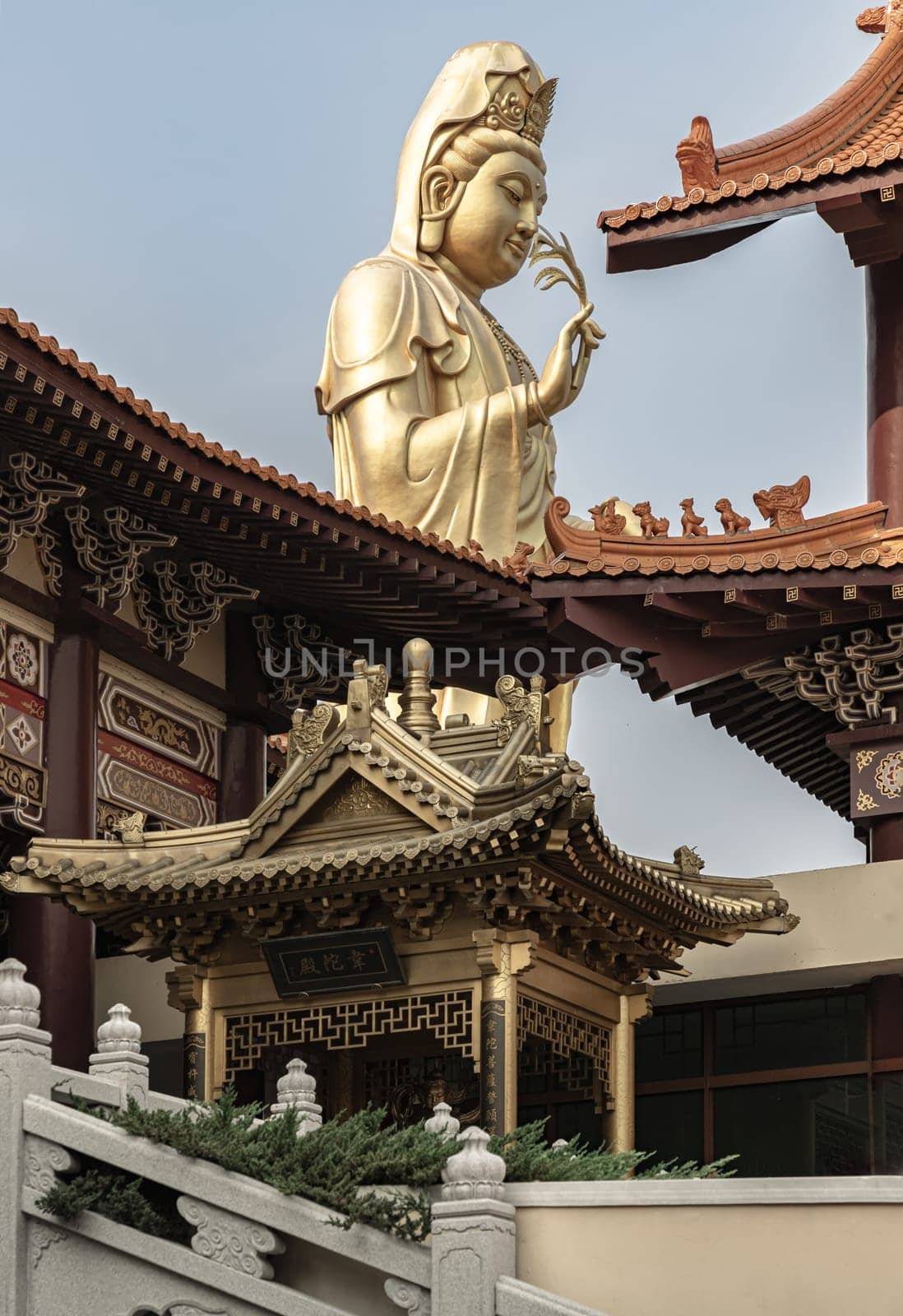 Bangkok, Thailand - Apr 11, 2024 - Big Golden statue goddess of Mercy Guanyin or Quan Yin statue at Fo Guang Shan Thaihua Temple. Guan Yin Buddha, Taiwanese temple style, Copy space, Selective focus.