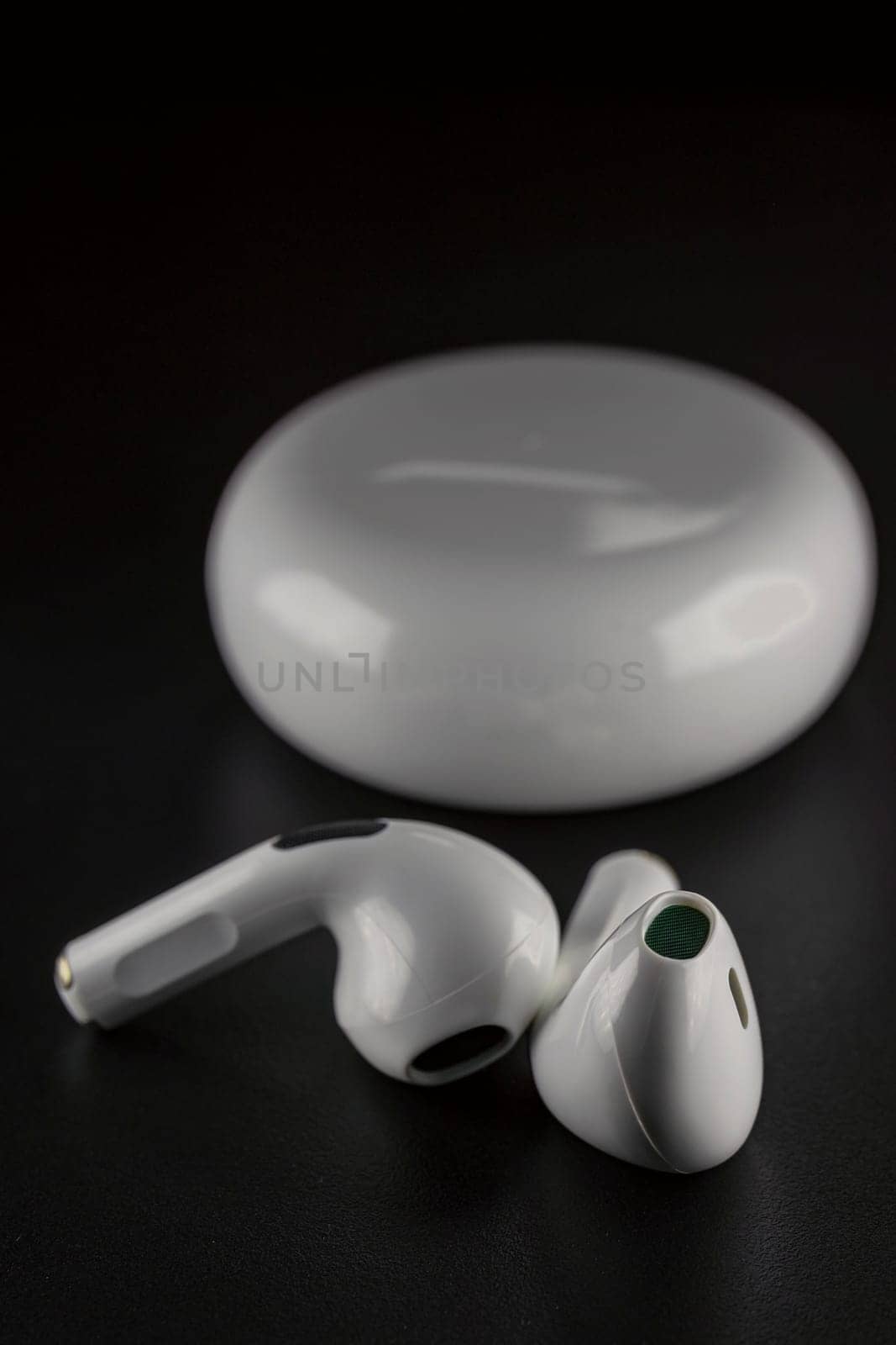 ROSTOV-ON-DON, RUSSIA - APRIL 28, 2018: Apple AirPods wireless Bluetooth headphones and charging case for Apple iPhone. New Apple Earpods Airpods in box.