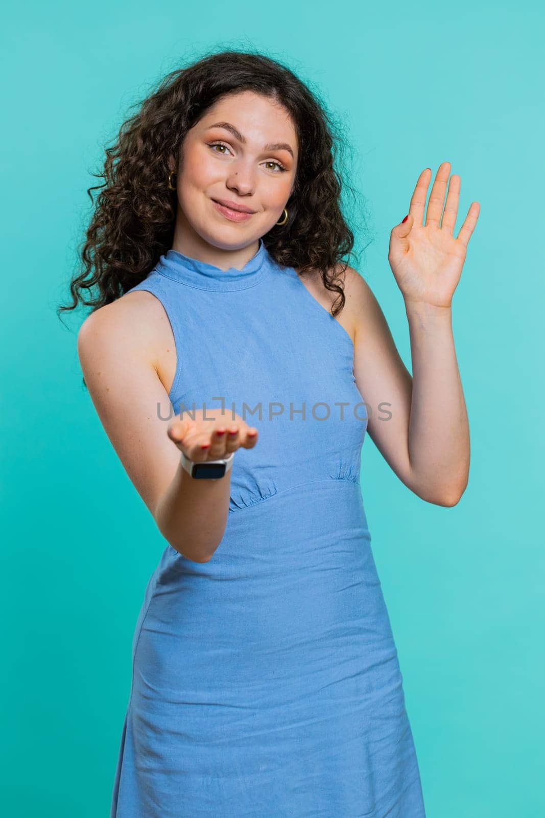 Woman showing inviting gesture with hands, ask to join, beckoning to coming, gesturing hello goodbye by efuror