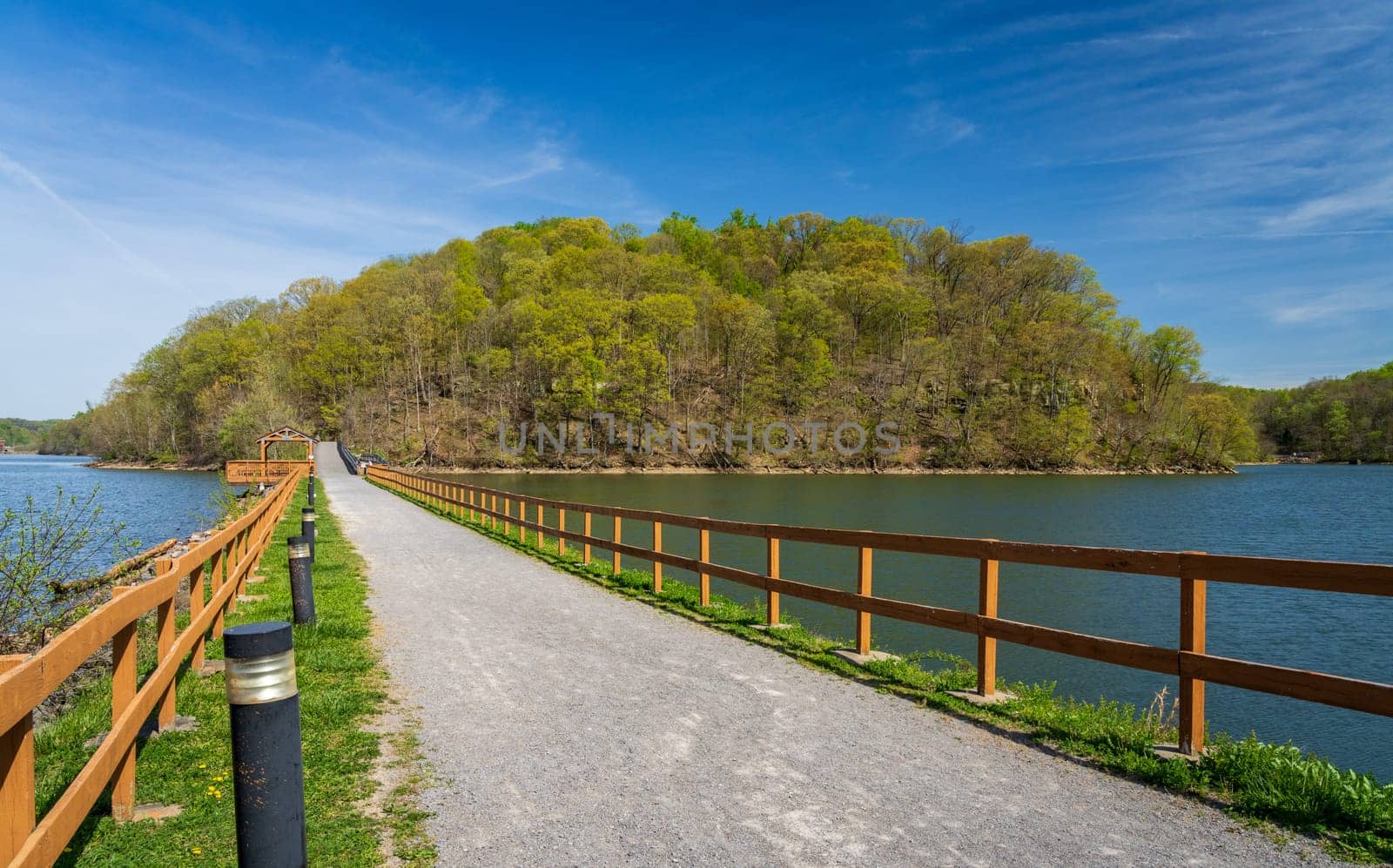 Warm light on the park at Cheat Lake near Morgantown West Virginia on a beautiful calm spring morning. The new leaves start to open on the trees