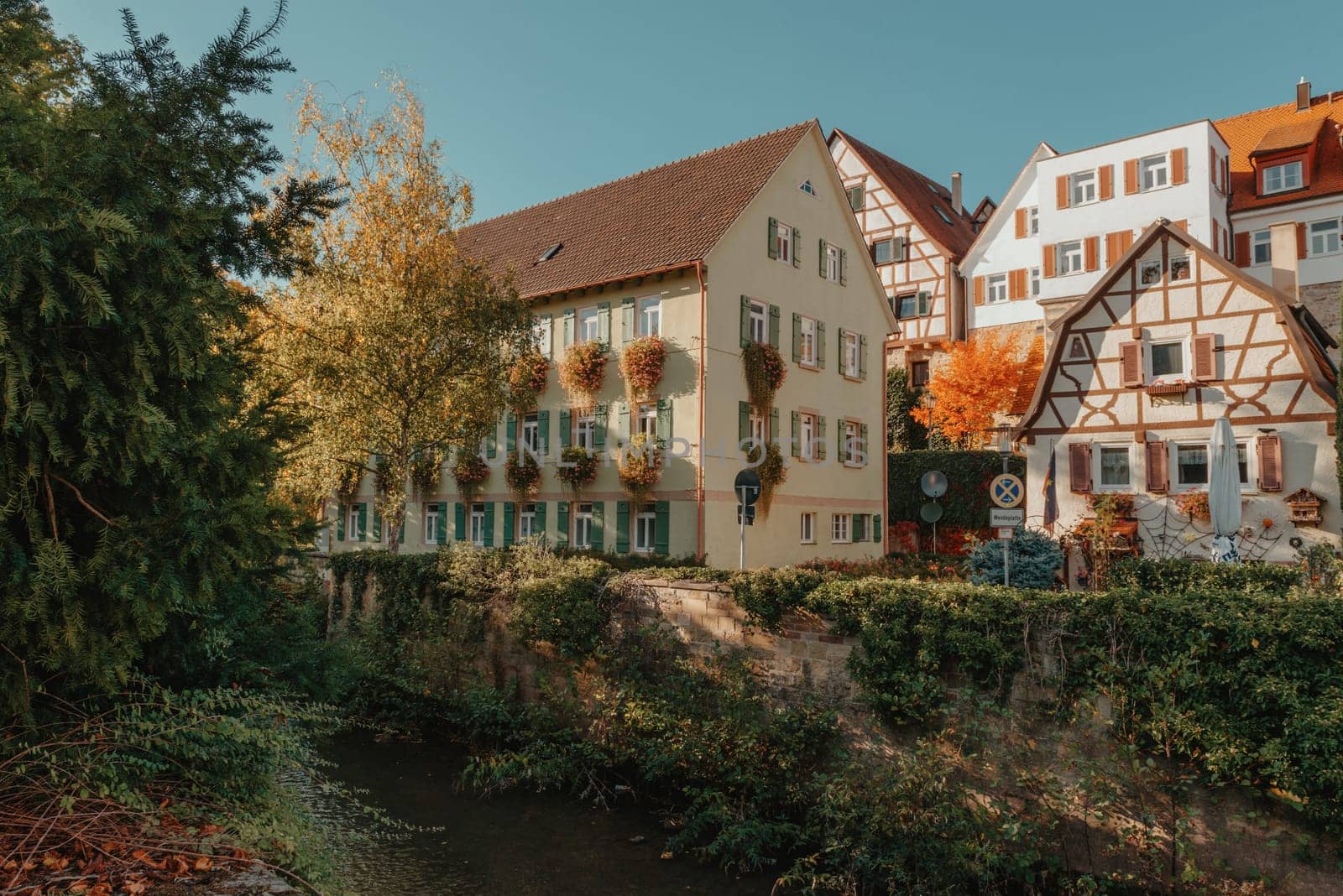 Old national German town house. Old Town is full of colorful and well preserved buildings. Baden-Wurttemberg is a state in southwest Germany bordering France and Switzerland. The Black Forest, known for its evergreen scenery and traditional villages, lies in the mountainous southwest. Stuttgart, the capital, is home to Wilhelma, a royal estate turned zoo and gardens. Porsche and Mercedes-Benz have headquarters and museums there. The 19th-century Hohenzollern Castle sits in the Swabian Alps to the south.