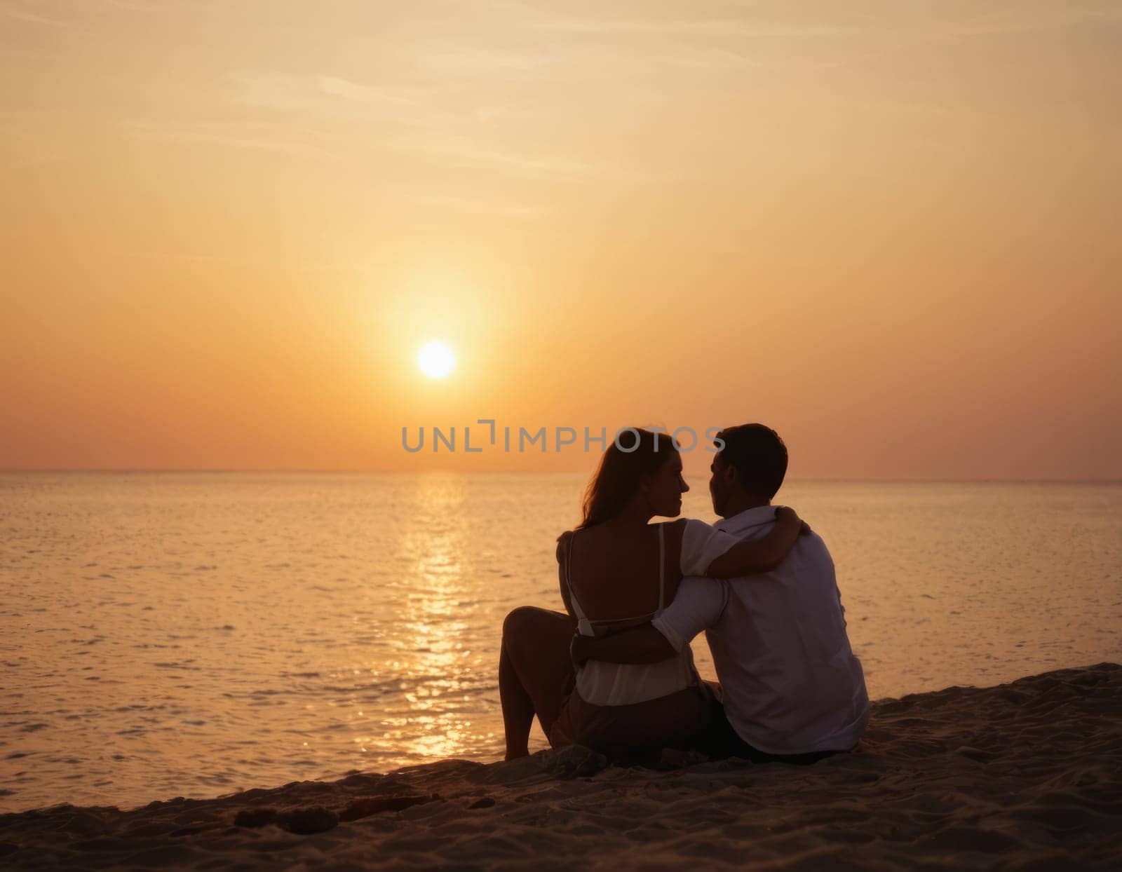 A romantic couple sitting on the beach at sunset, with the sun setting over the horizon and the ocean in the background