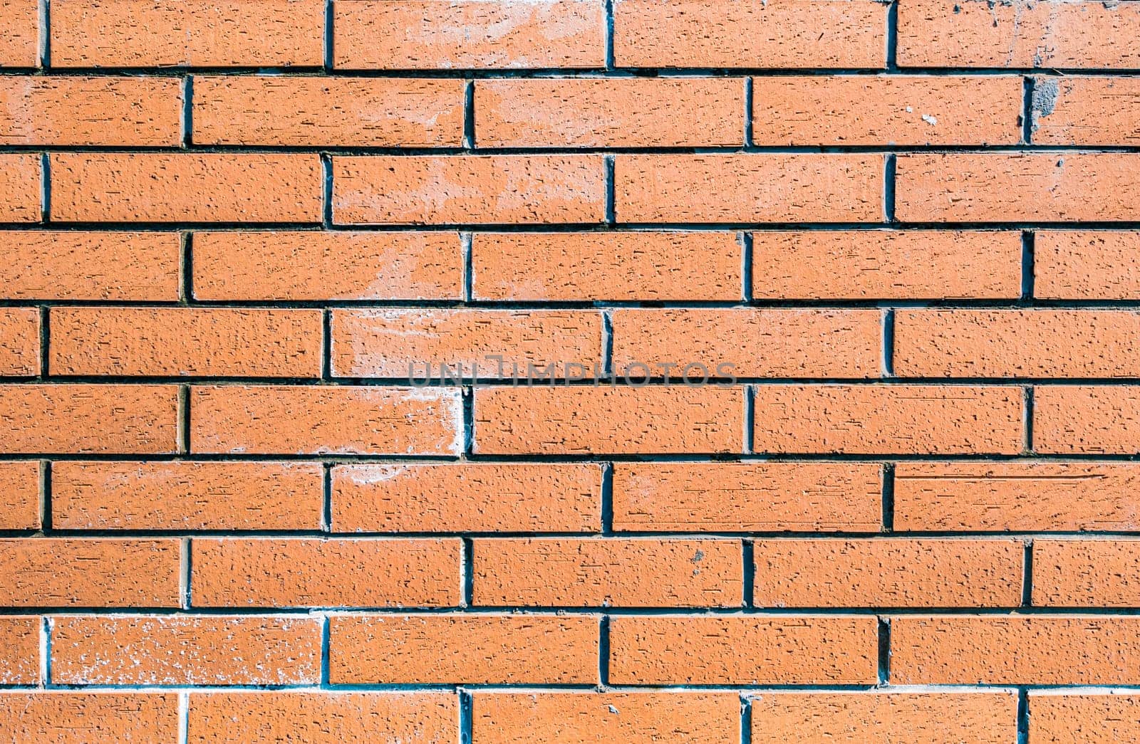 Background of red brick wall by Busker