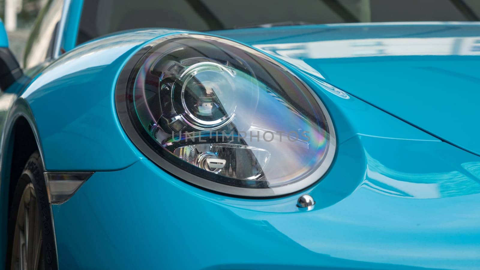 Close-up photo of blue Porsche at motorshow