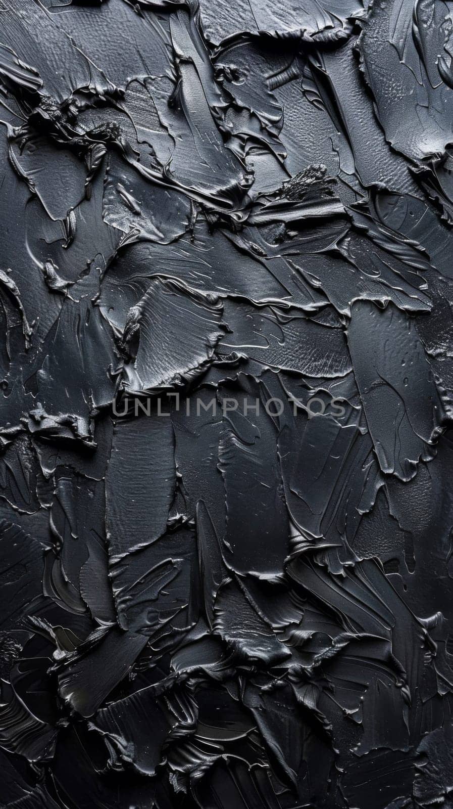 A close up of a black painted wall with some scratches