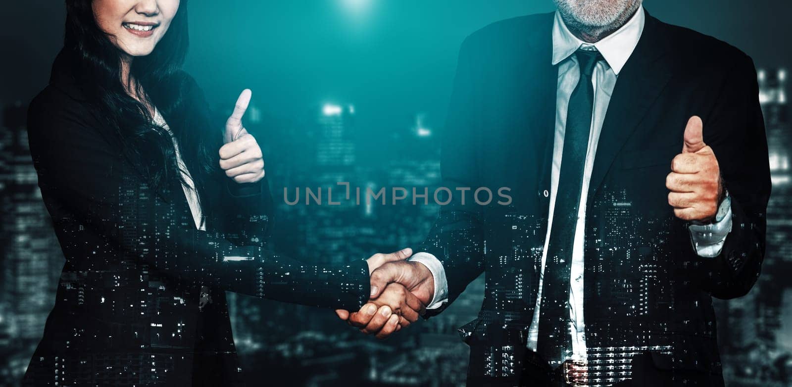 Double exposure image of business people handshake on city office building in background show partnership success of business deal. Concept of corporate teamwork, trust partner and work agreement. uds