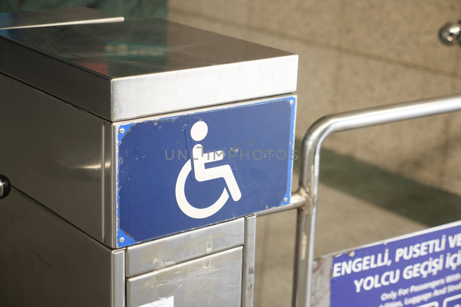 blue wheelchair symbol displayed at metro station by towfiq007