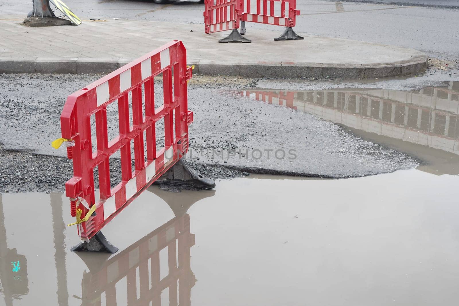 Big pot hole filled with water at street