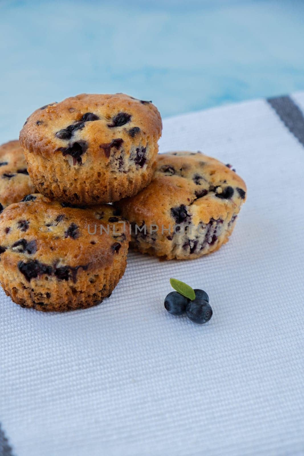 Homemade baked fresh blueberry muffins. Tasty pastry sweet cupcake dessert. Berry pie Healthy vegan cupcakes with organic berries. Gluten free healthcare recipe from alternative flour