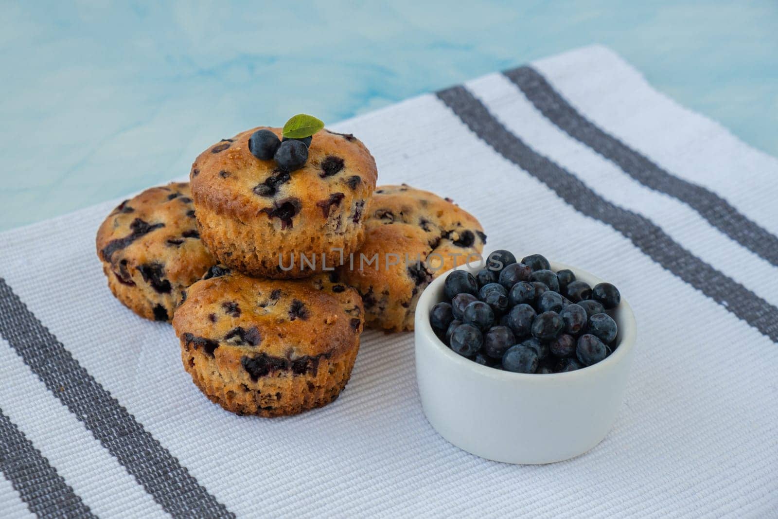 Homemade baked blueberry muffins with fresh blackberries. Tasty pastry sweet cupcake dessert. Berry pie Healthy vegan cupcakes with organic berries. Gluten free healthcare recipe from alternative flour
