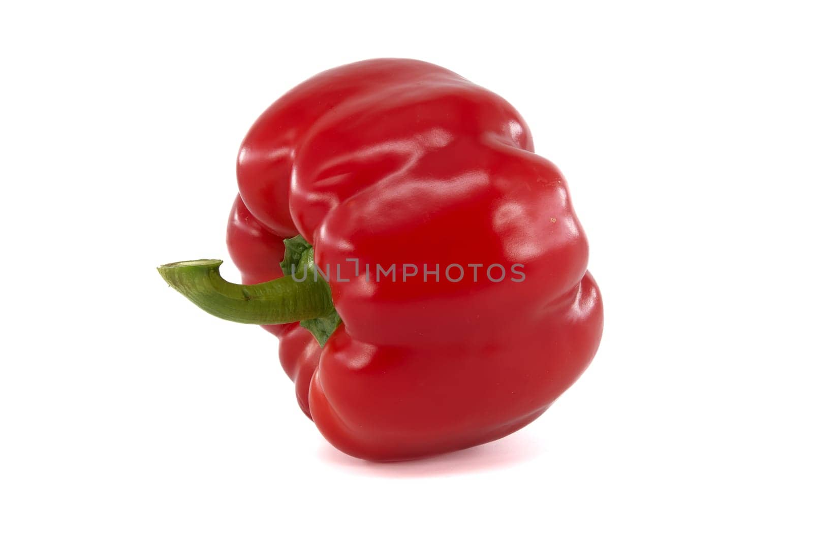 Fresh ripe red bell pepper isolated on white background