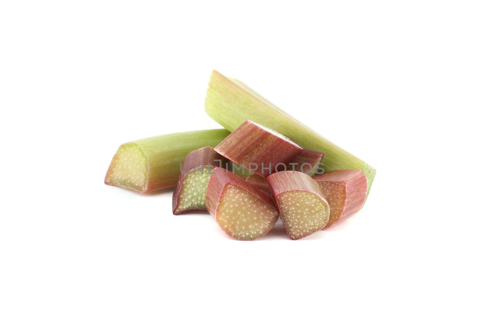 Variety of rhubarb stalks of varying colors from pale green to deep red isolated on white background, health benefits of eating rhubarb