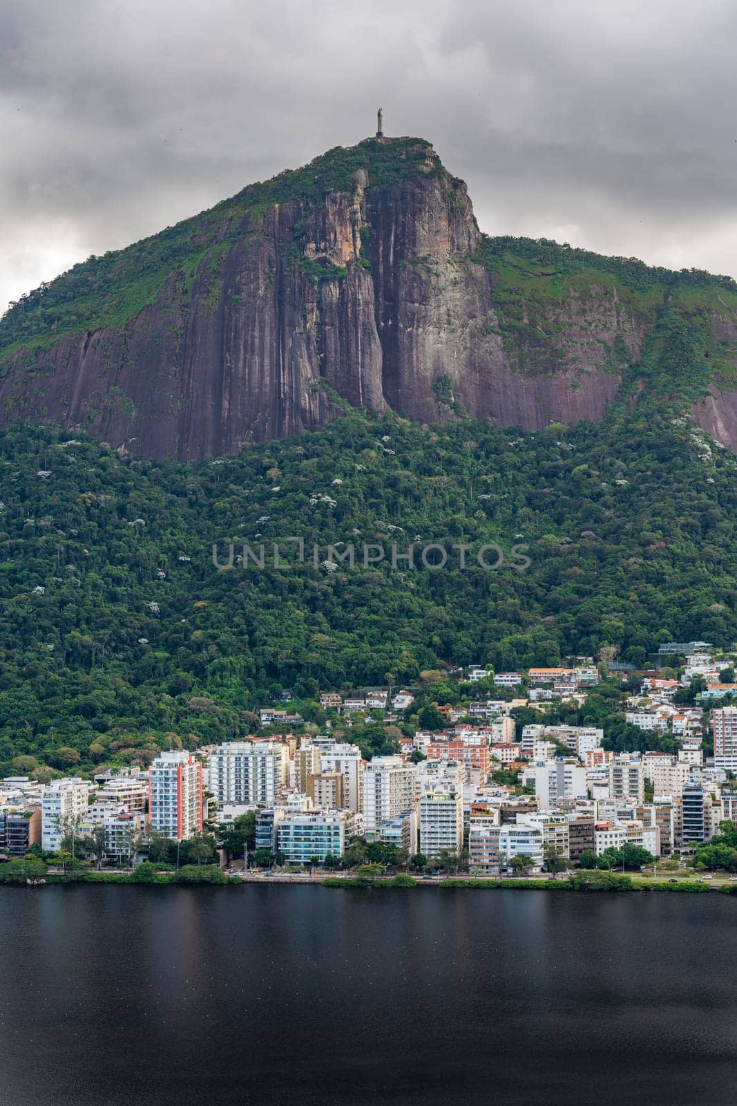Iconic Rio de Janeiro scene with Christ the Redeemer overlooking Lagoa from a peak.