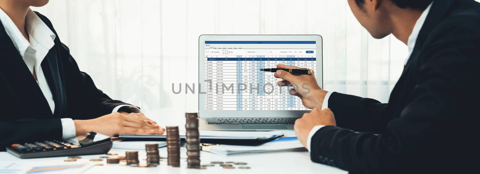 Corporate accountant use accounting software on laptop to calculate and maximize tax refunds and improve financial performance with business investment concept of growth stack coin in panorama. Shrewd