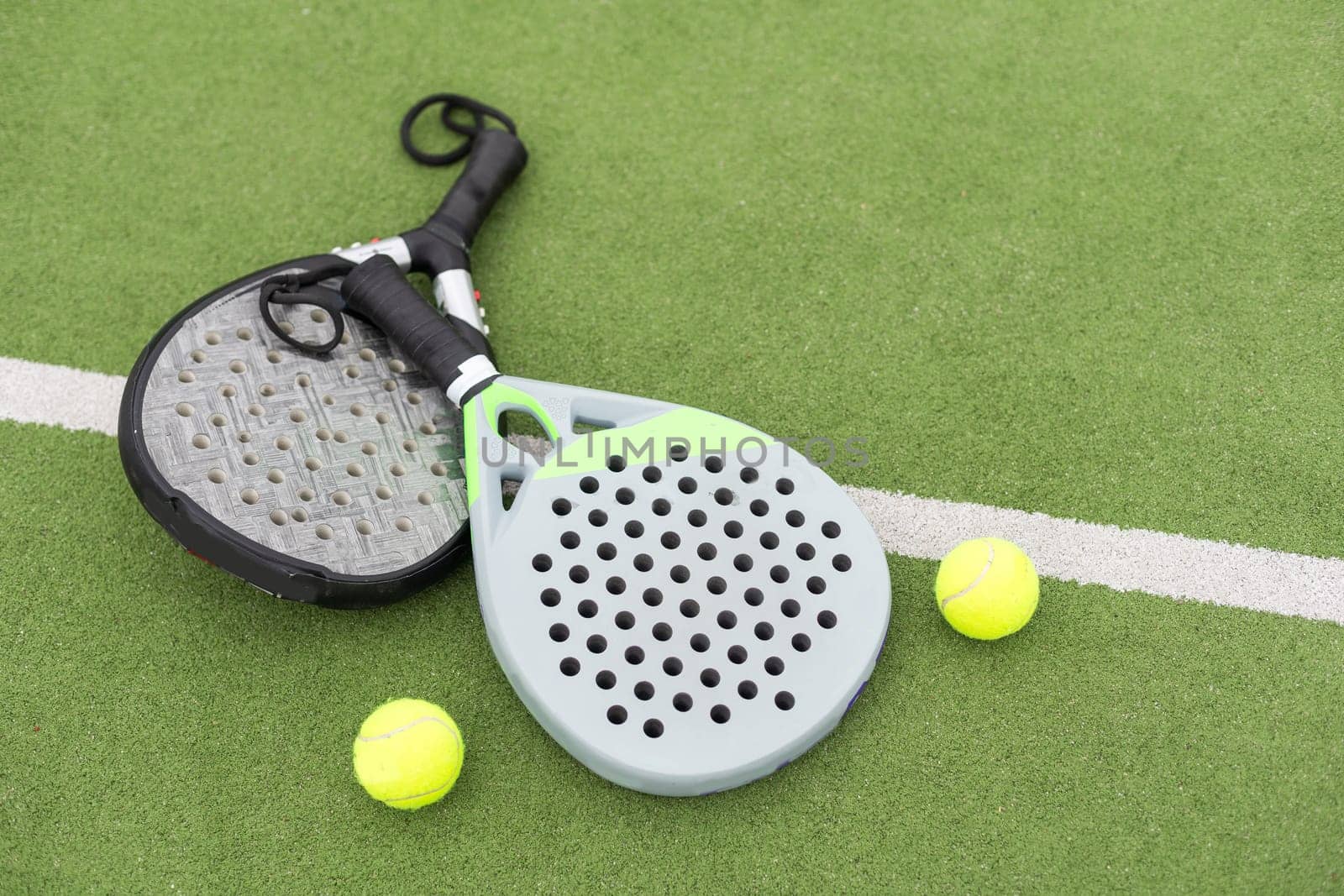 Paddle tennis objects on grass court. High quality photo