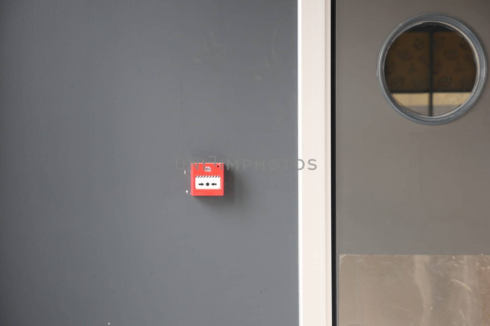 Red fire alarm button on wall , by towfiq007