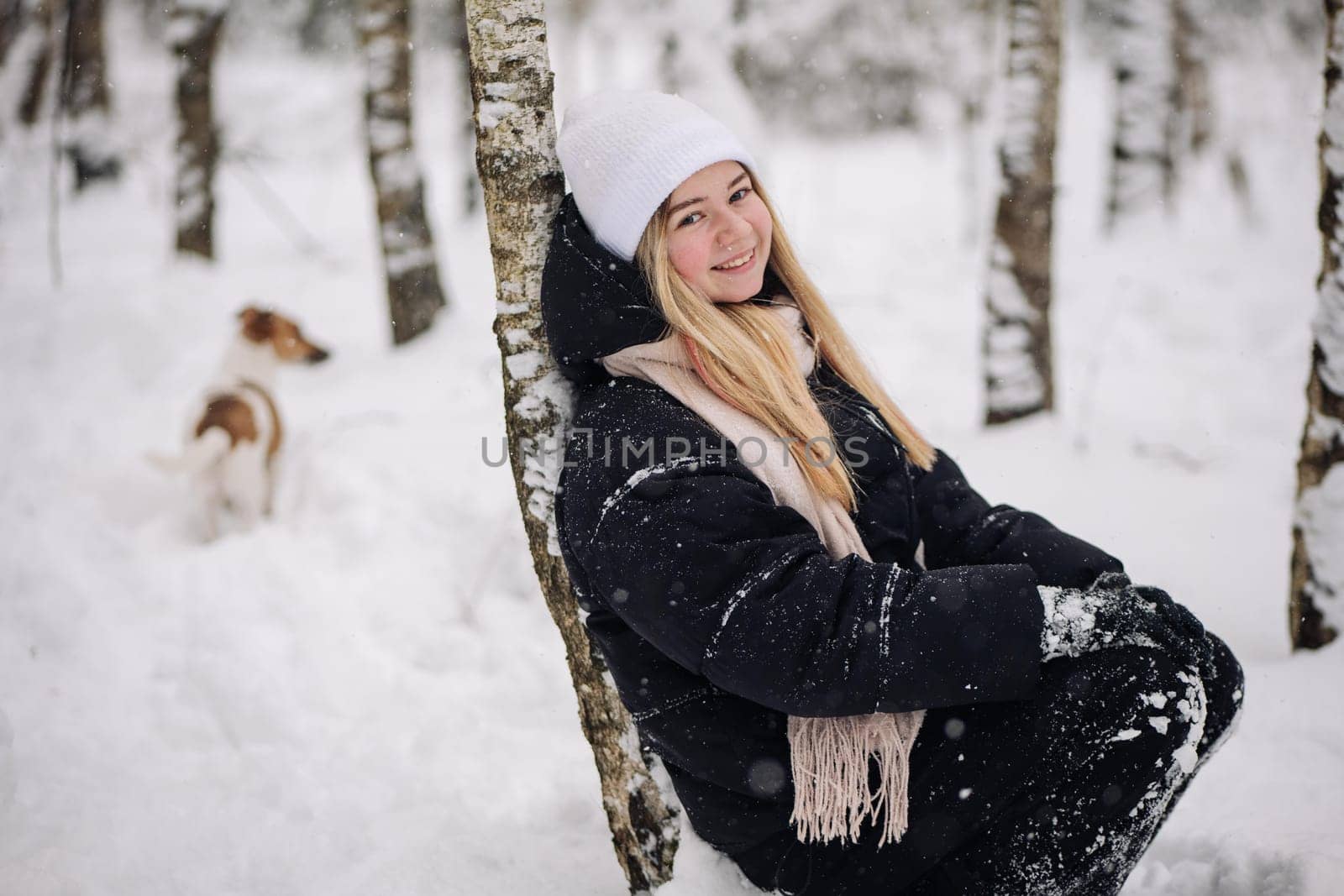 Portrait of a teenage girl in winter in the woods