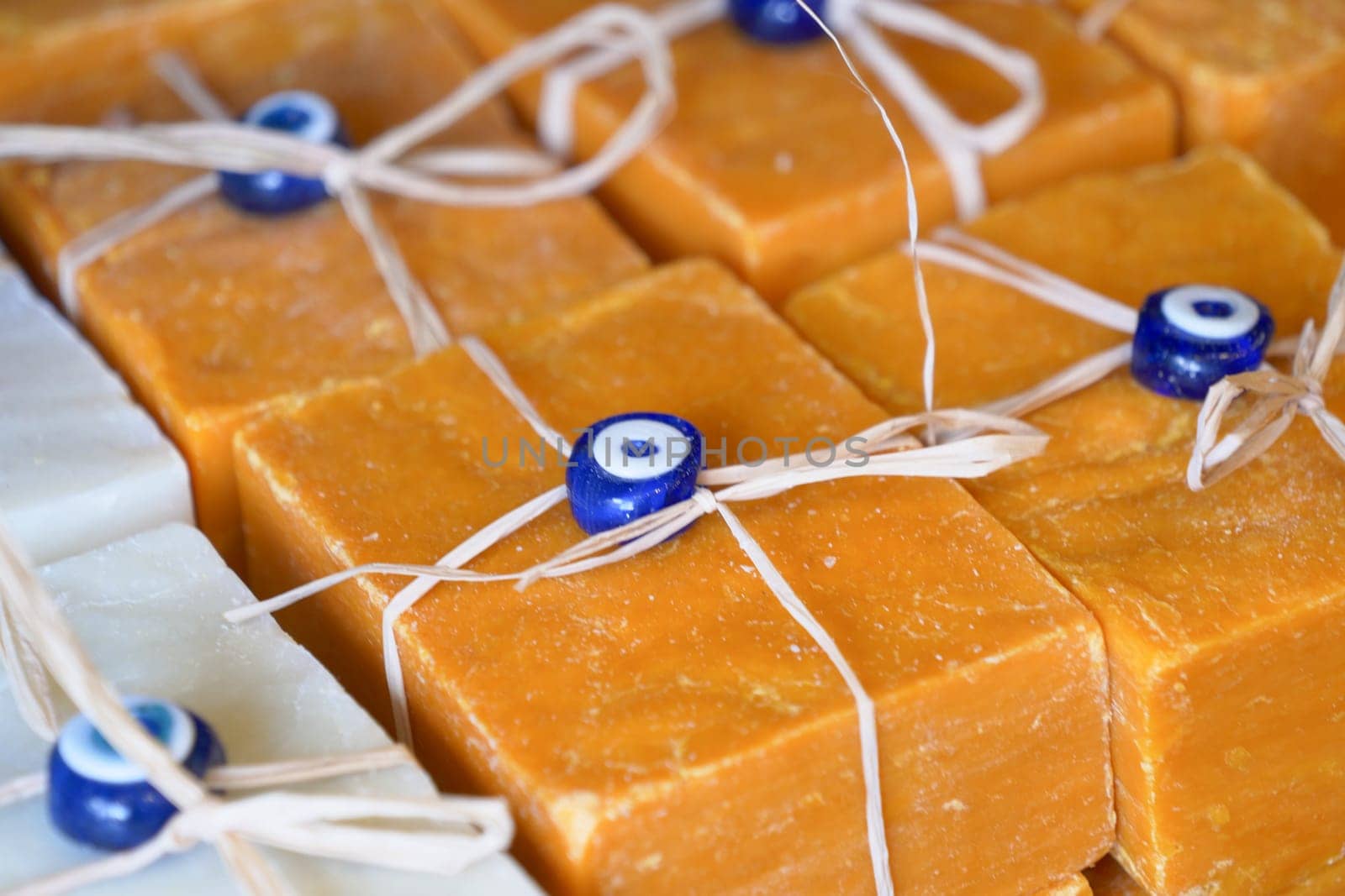 Stack of soap topped with evil eye beads