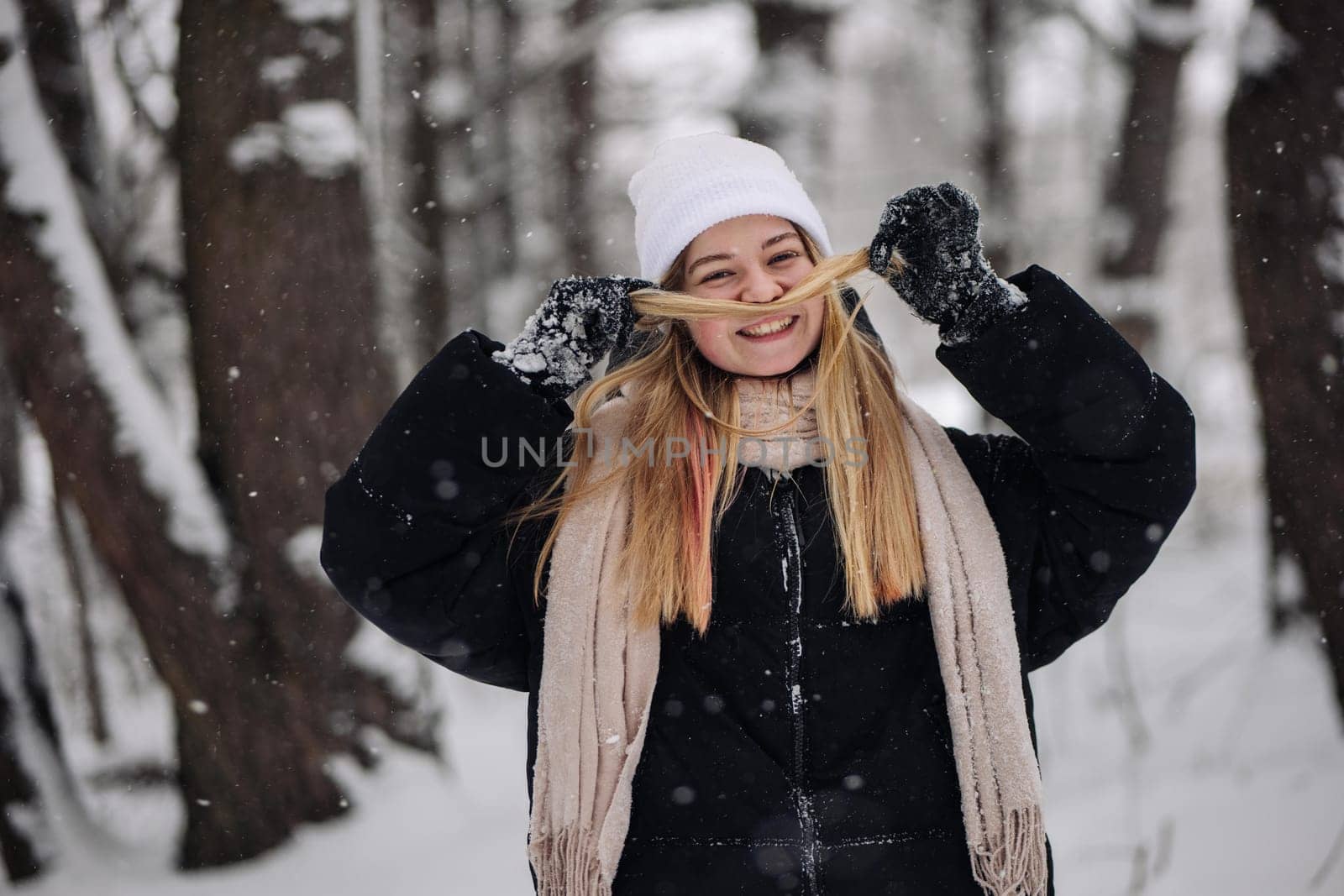 Funny teenage girl posing in the woods in winter. by DovidPro