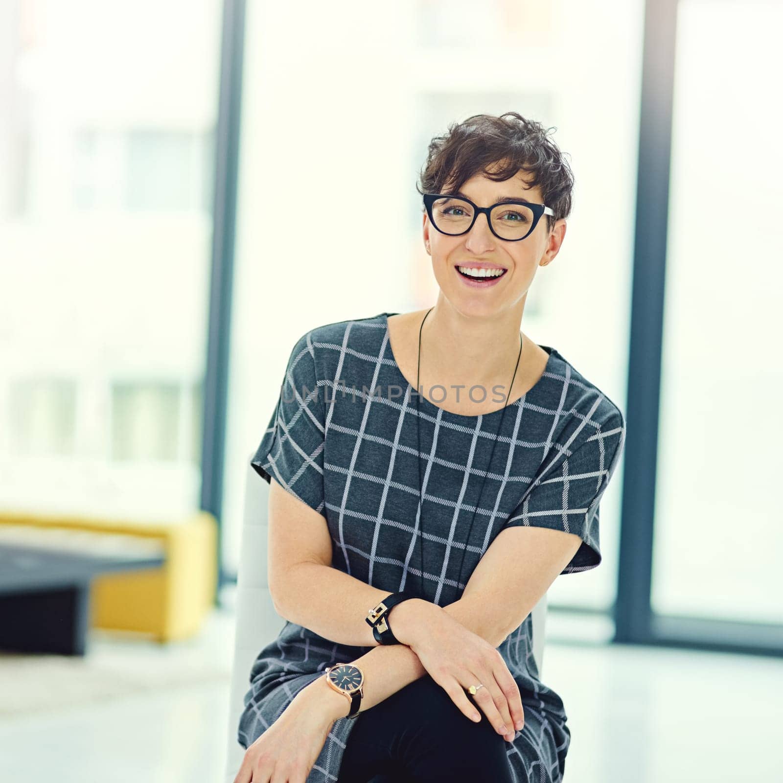 Woman creative, smiling and portrait in office with glasses for confidence, vision and career. Female person, proud and positive in workplace with specs for ambition, success and development in city by YuriArcurs