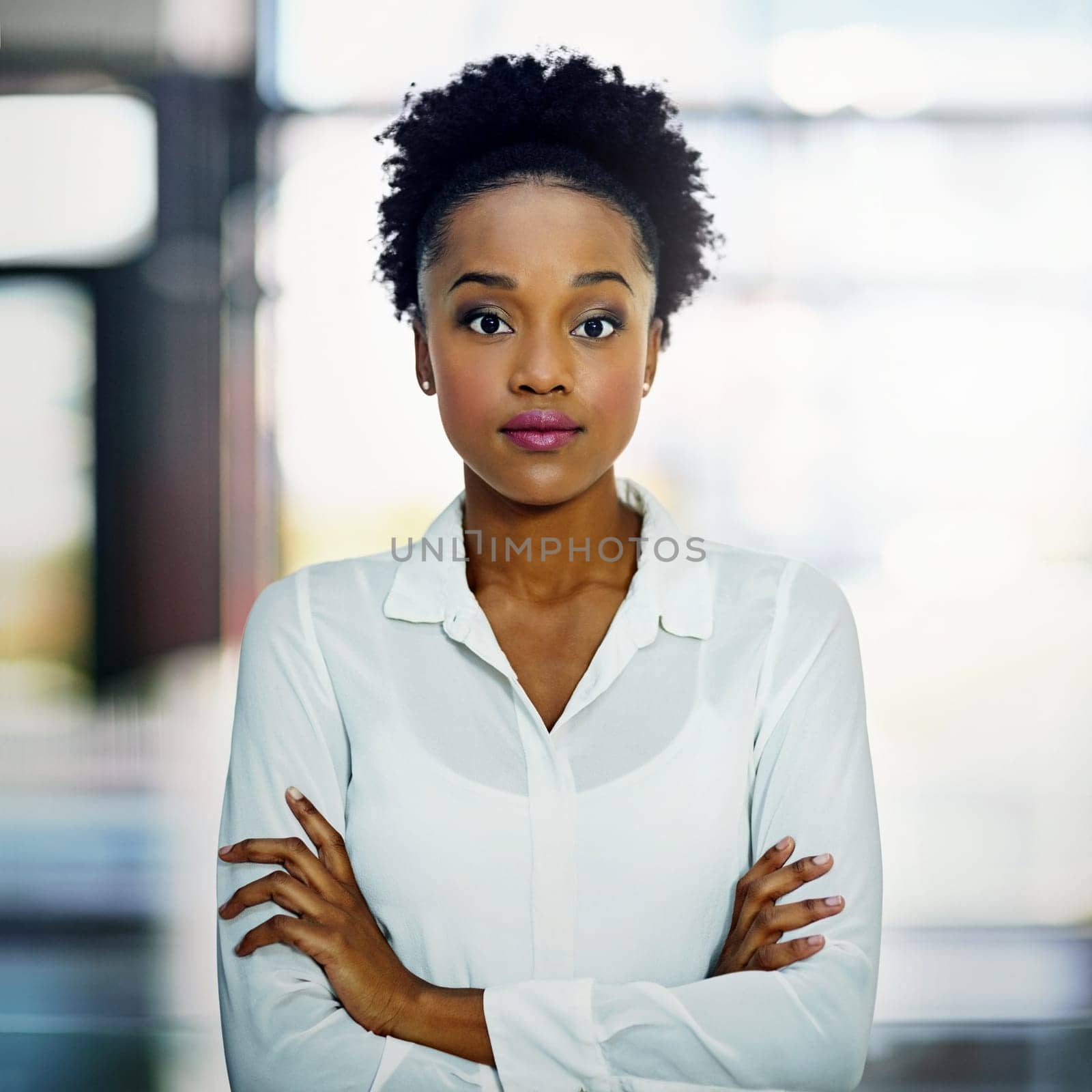 African businesswoman, portrait and office with arms crossed, proud and confidence for goals. Corporate lawyer, professional law firm and expert attorney for success, management and startup workspace.