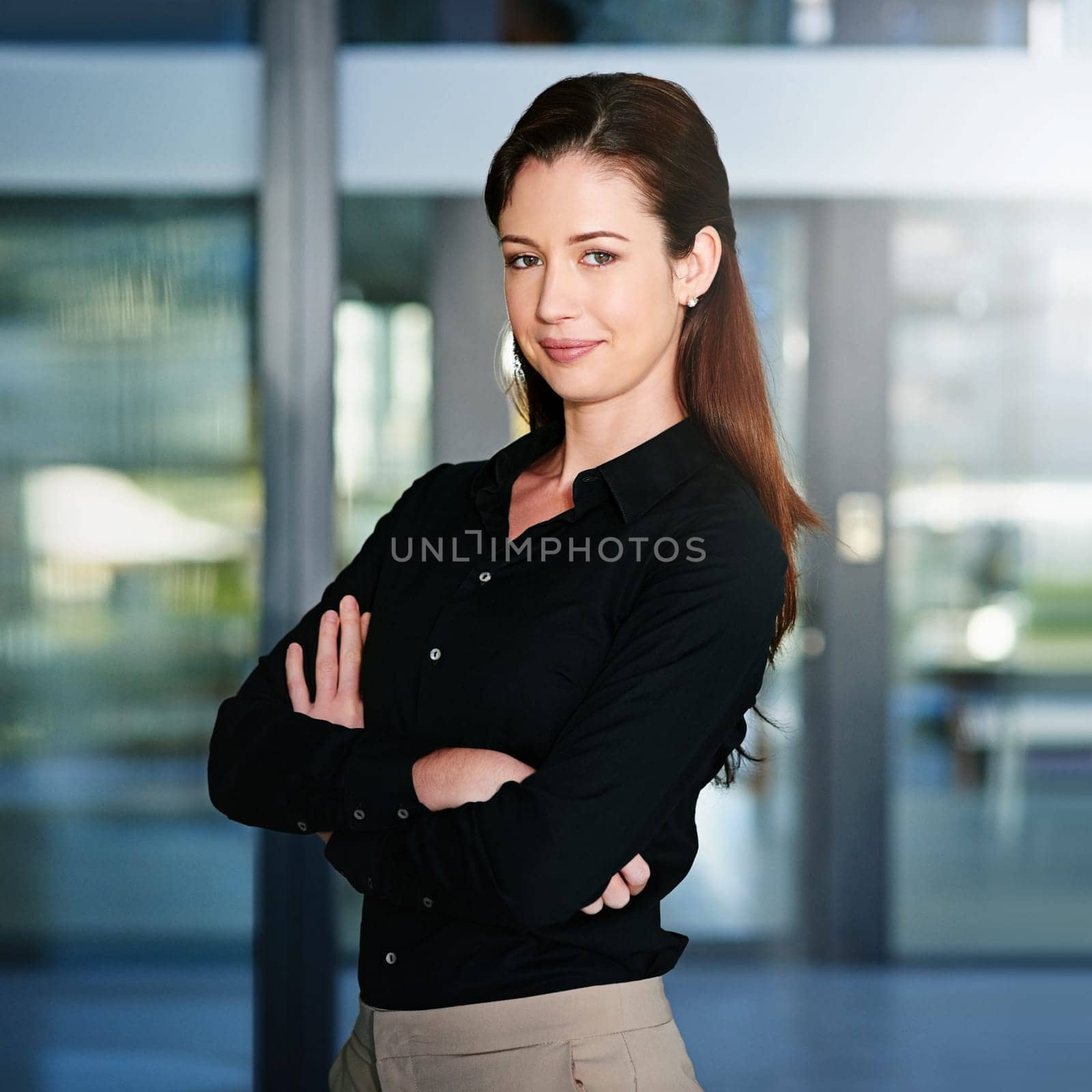 Portrait, professional and business woman with pride in office, smile or positive attitude. Content editor, face and female person with arms crossed, ambition and employee for journalism career by YuriArcurs