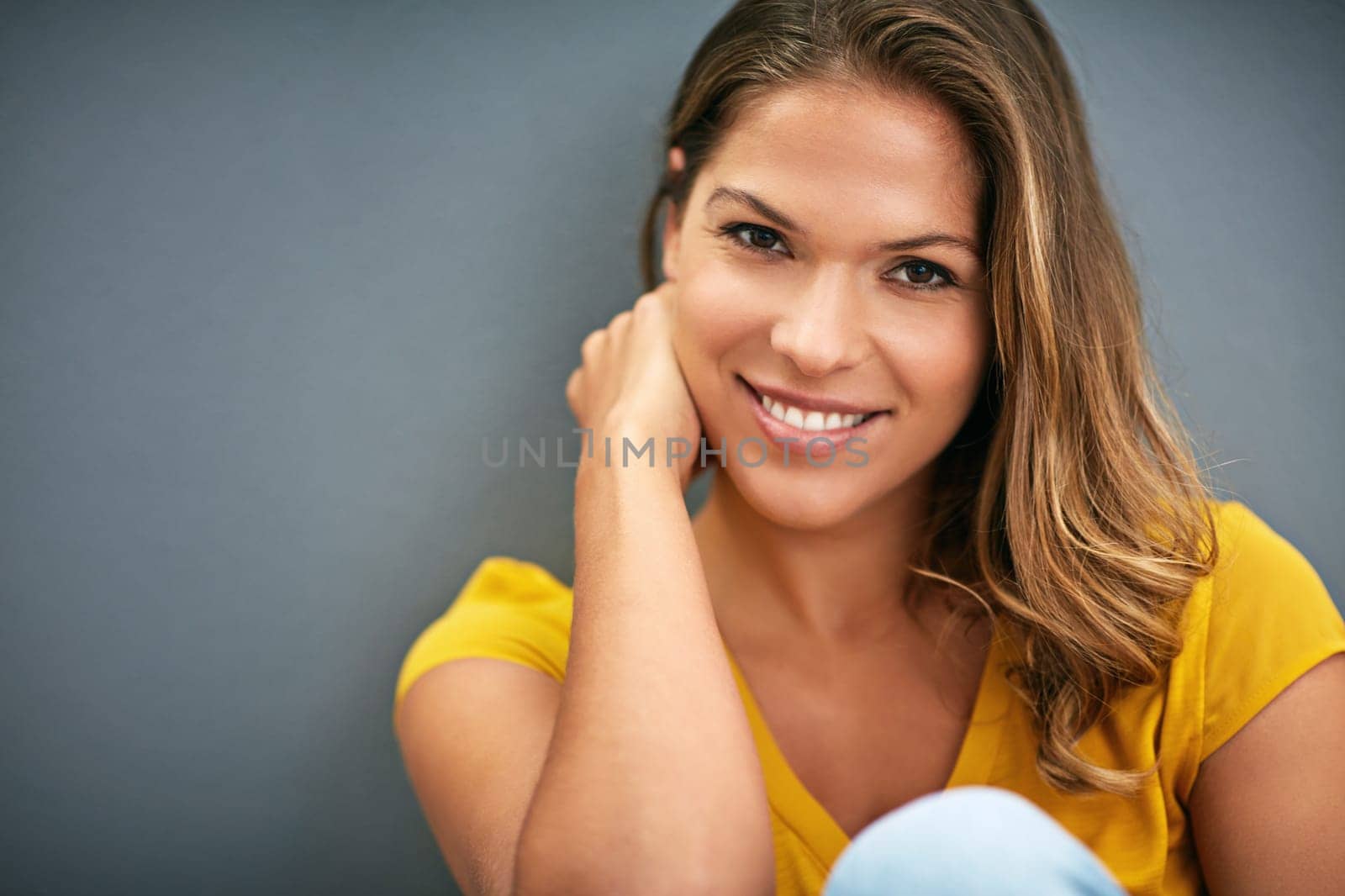 Wall, smile and woman in room, portrait and relax for weekend, Gen z and streetwear for fashion in house. Grey background, happiness and girl in apartment, cheerful and comfortable on ground of home.