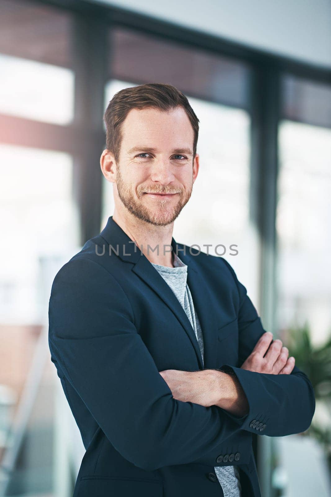 Business man, portrait and arms crossed with job confidence and public relations worker. Office. about us and corporate professional with smile at startup company with happy employee at workplace by YuriArcurs