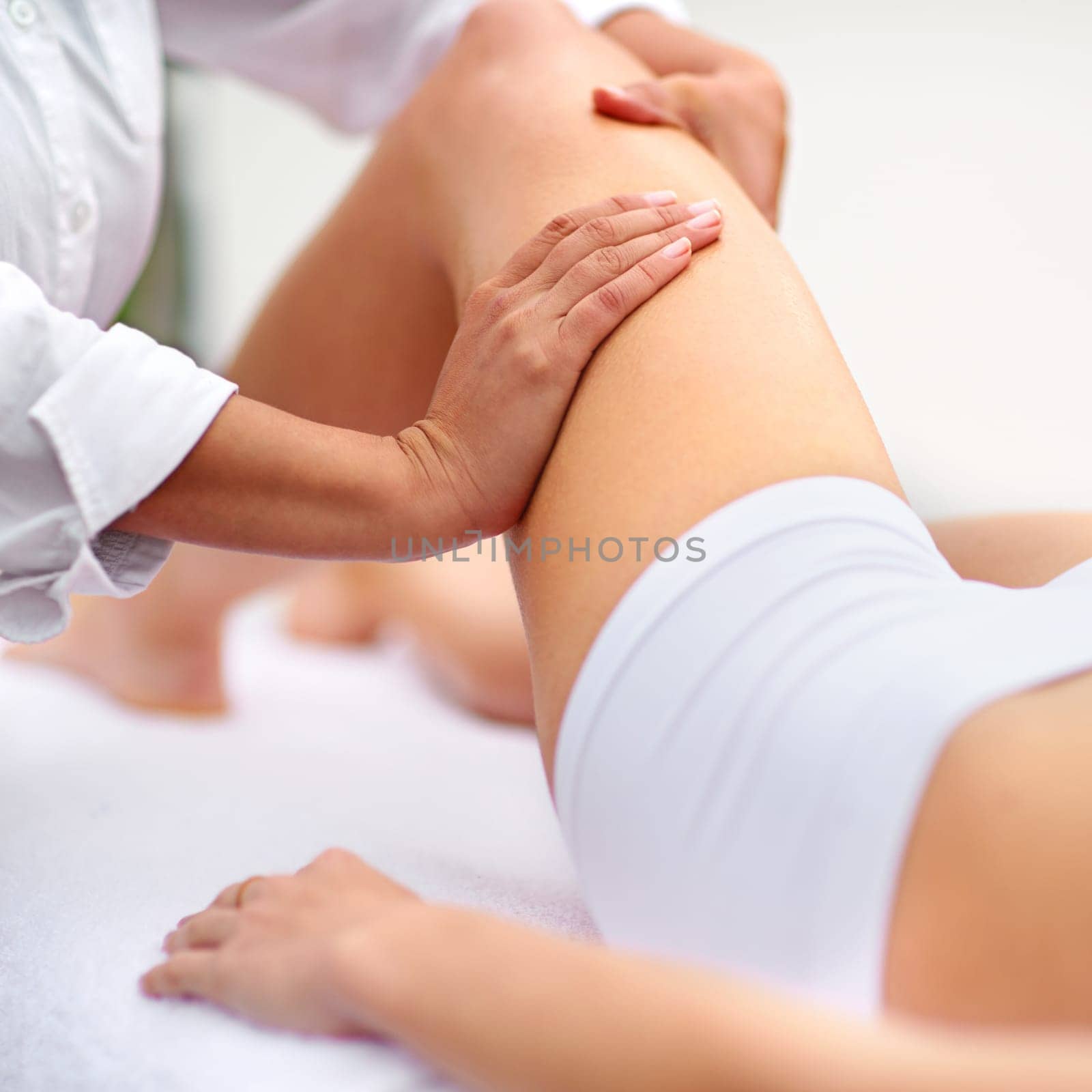 Woman, spa and leg massage for physiotherapy, health and physical therapy for wellbeing break. Lady, detox and muscle treatment for body care, stress relief and zen for peaceful beauty or skincare.