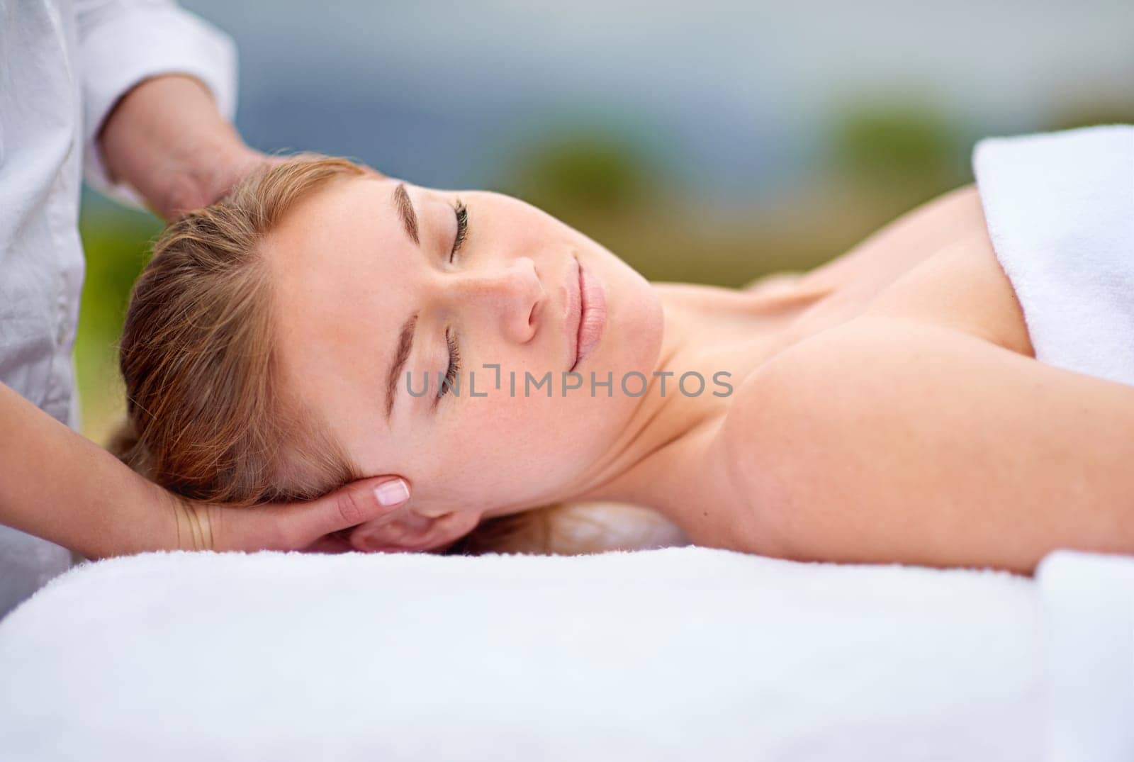 Woman, spa and relax with head massage with comfort for stress relief with beauty or health. Calm, zen and resting with masseuse hands for wellbeing on holiday for bliss with professional for peace by YuriArcurs