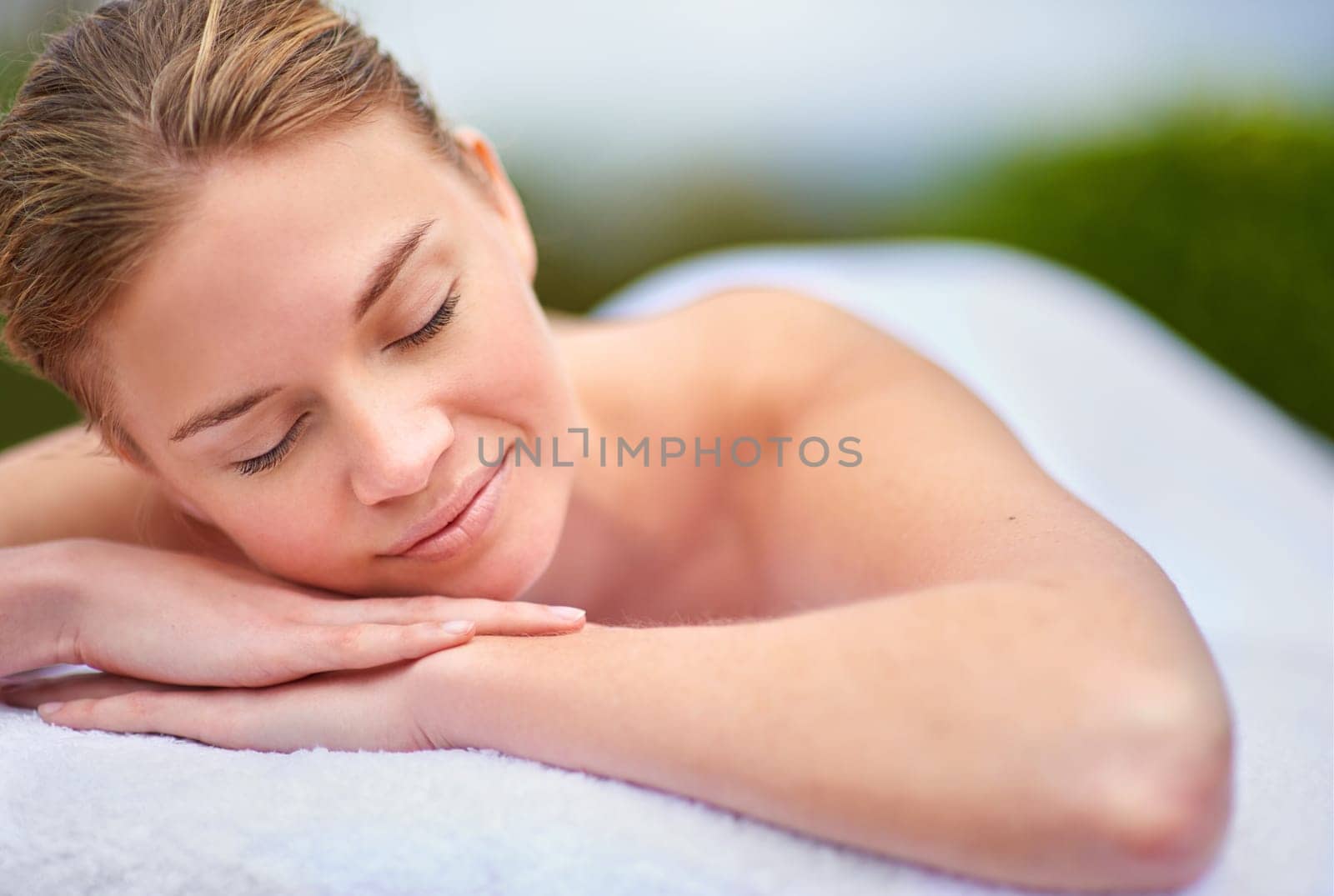 Massage, woman and spa for health, wellness and happiness in zen, peace and healing for self care. Female person, aromatherapy and detox for body with smile, calm and relaxation on vacation in Bali by YuriArcurs