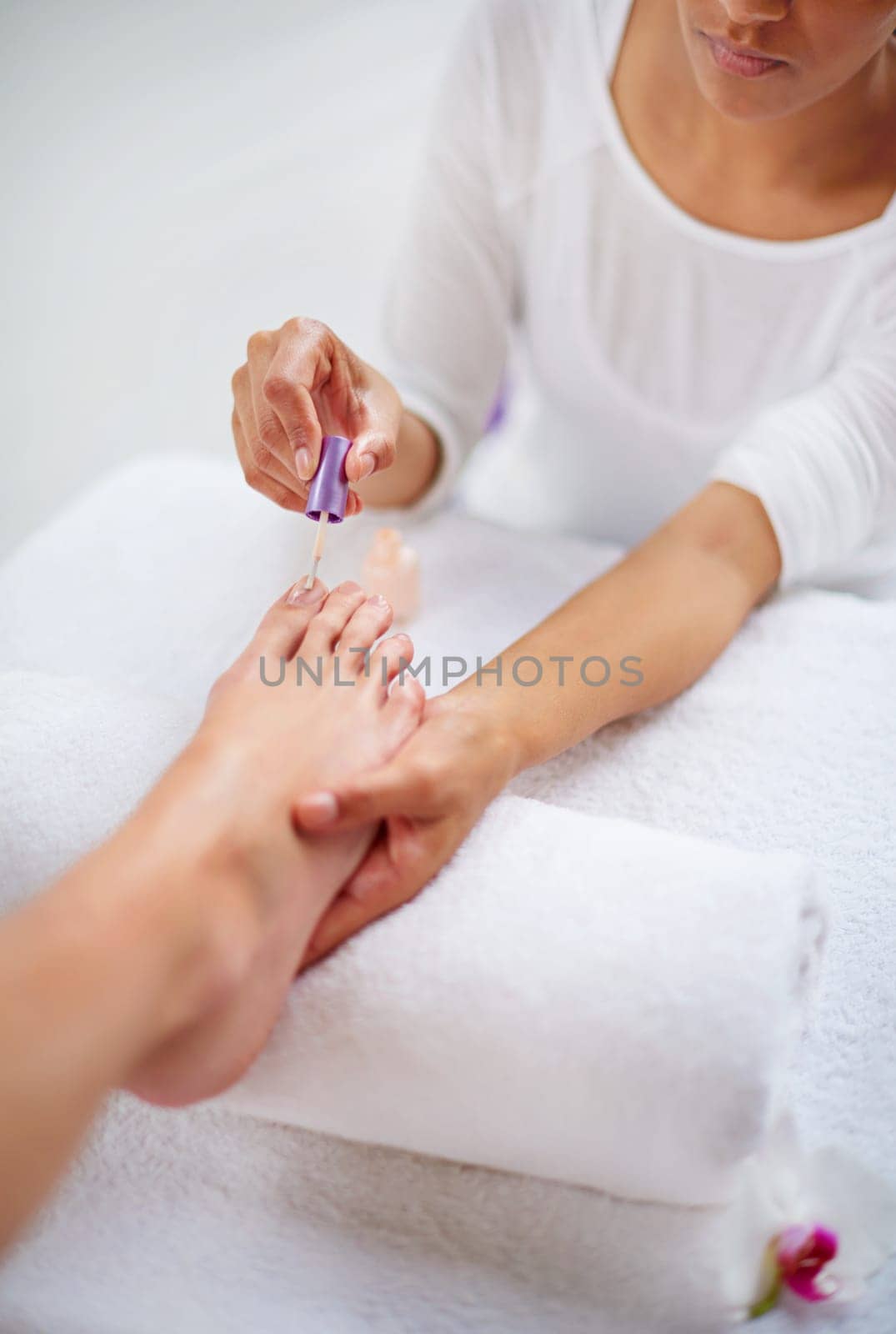 Foot, people and nail polish for pedicure closeup at spa, hands for treatment and skin with dermatology and makeup. Beauty, wellness and cosmetics product for color, self care and cosmetology.