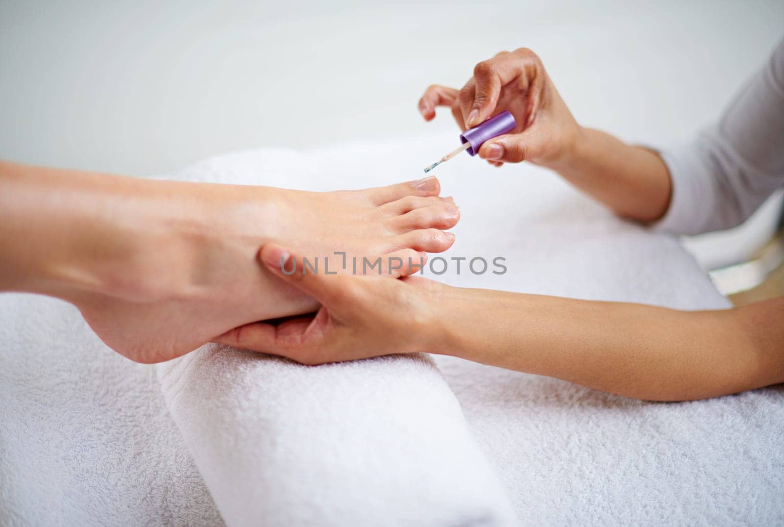 Foot, hands and nail polish for pedicure with beauty, skin and dermatology with makeup at spa. Treatment, wellness and people with cosmetics product for color, self care and cosmetology at resort.
